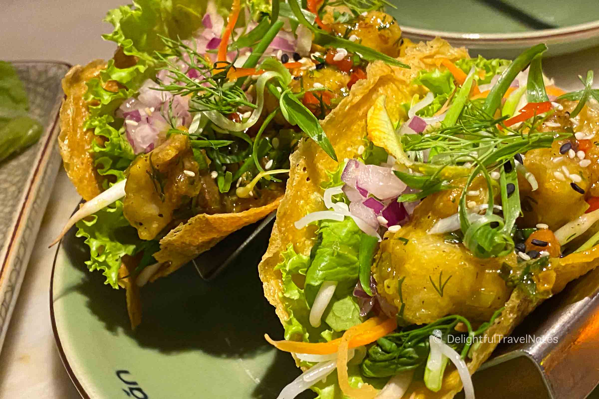 a plate of banh xeo tacos at Anan Saigon, one of the best Vietnamese restaurants in Ho Chi Minh city