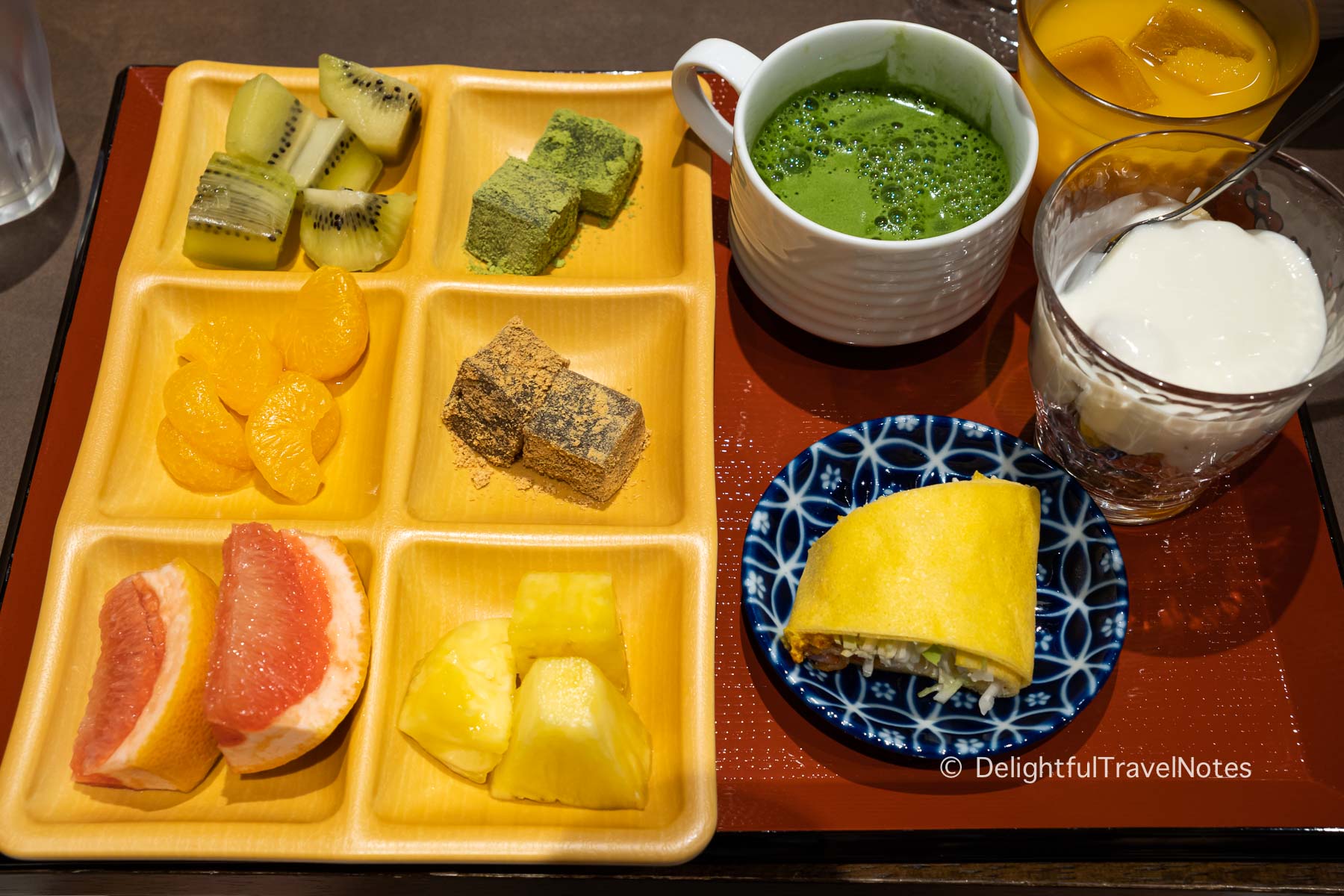 a tray of fruits and desserts from the Celestine Hotel Gion breakfast