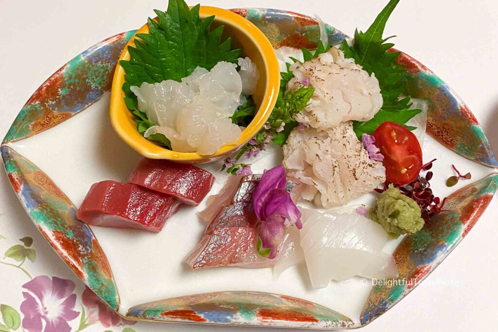 a plate of different types of sashimi served at Hanasaki Manjiro restaurant.