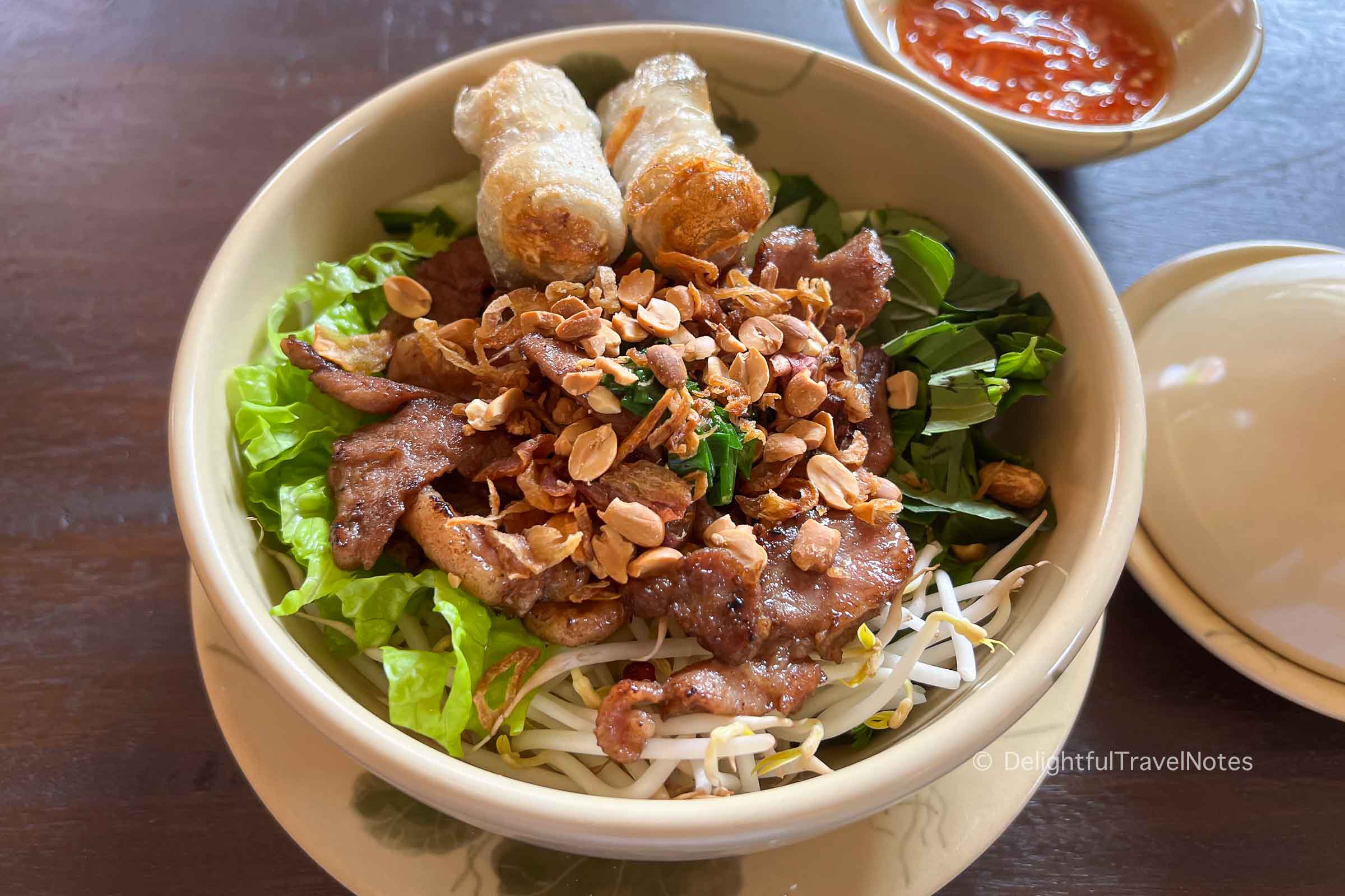 a bowl of Vietnamese grilled pork noodle salad at Quan Bui restaurant in HCMC.