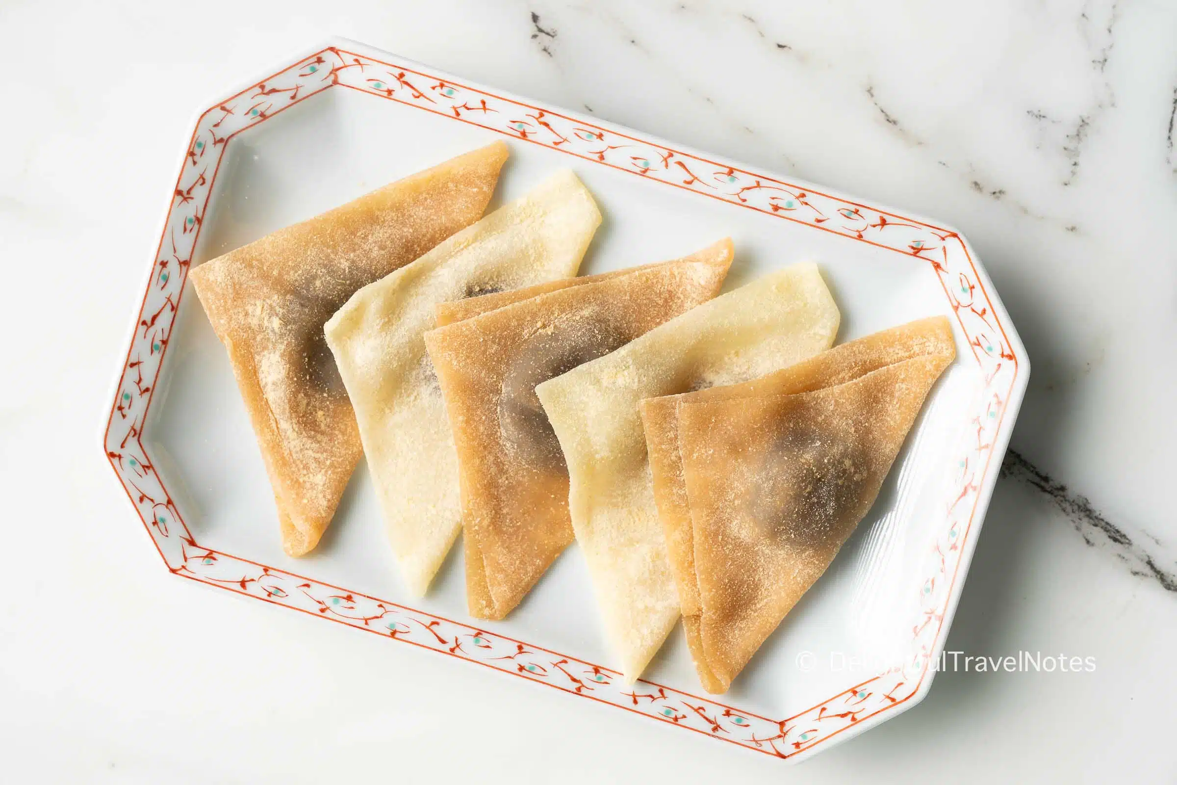 a plate of yatsuhashi, a must-eat Kyoto traditional sweet.