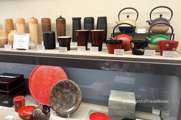 Japanese tableware on display shelves.