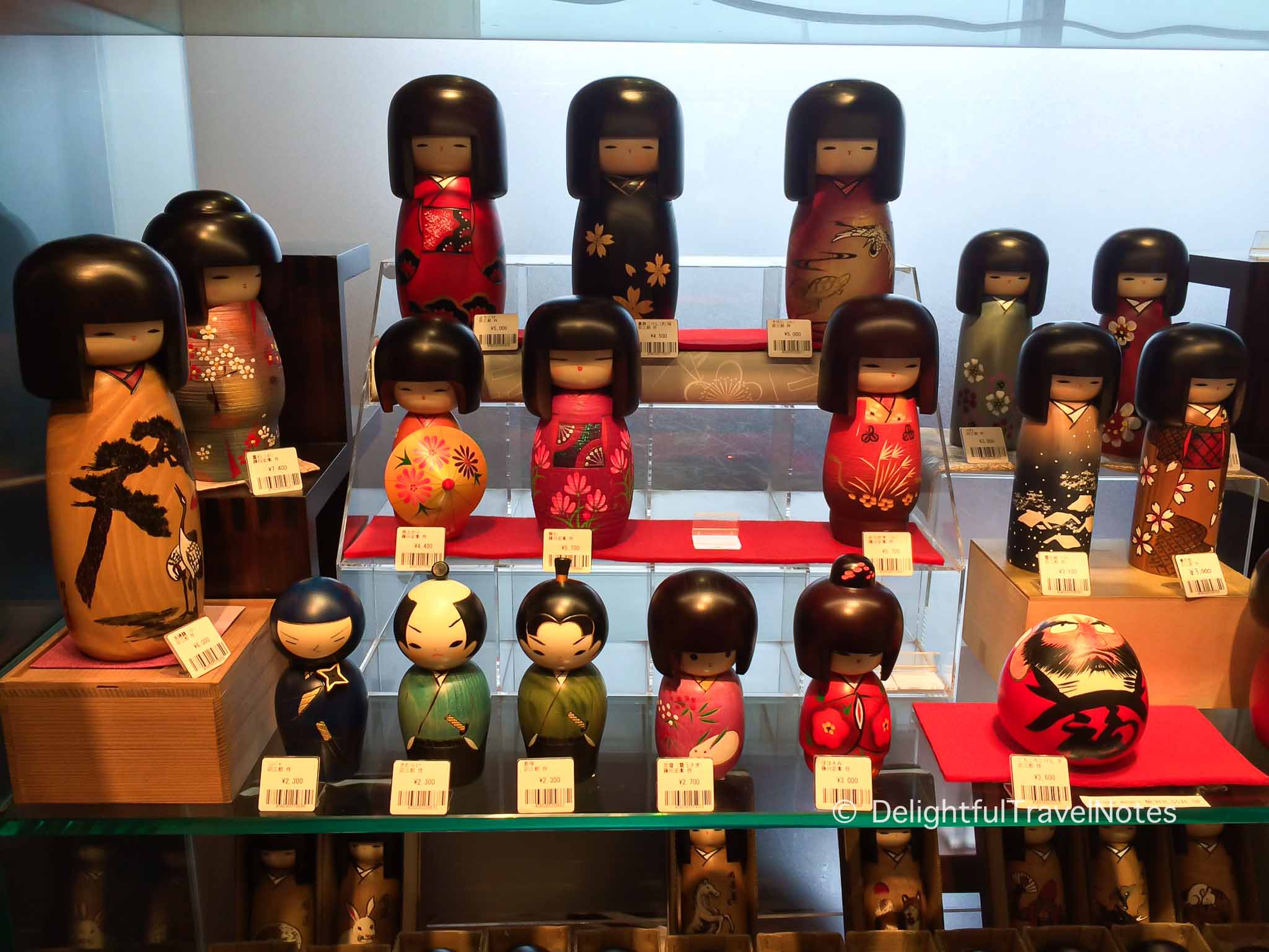 a shelf of Kokeshi dolls, a great souvenir from Japan.
