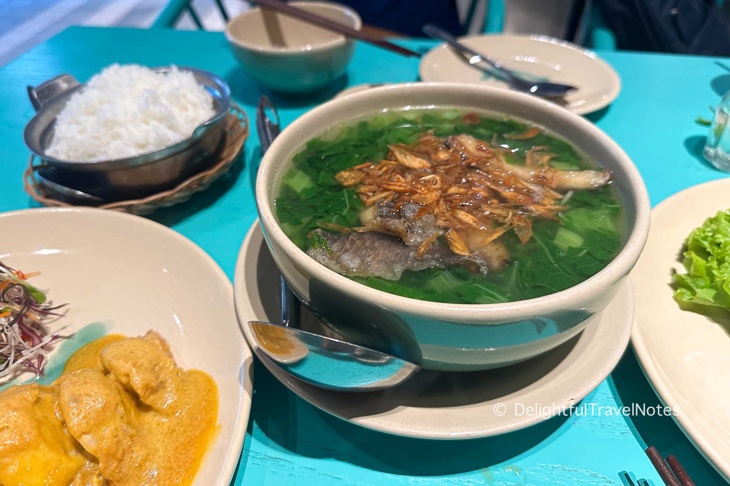 a bowl of Vietnamese mustard green soup with fish at Laang restaurant.