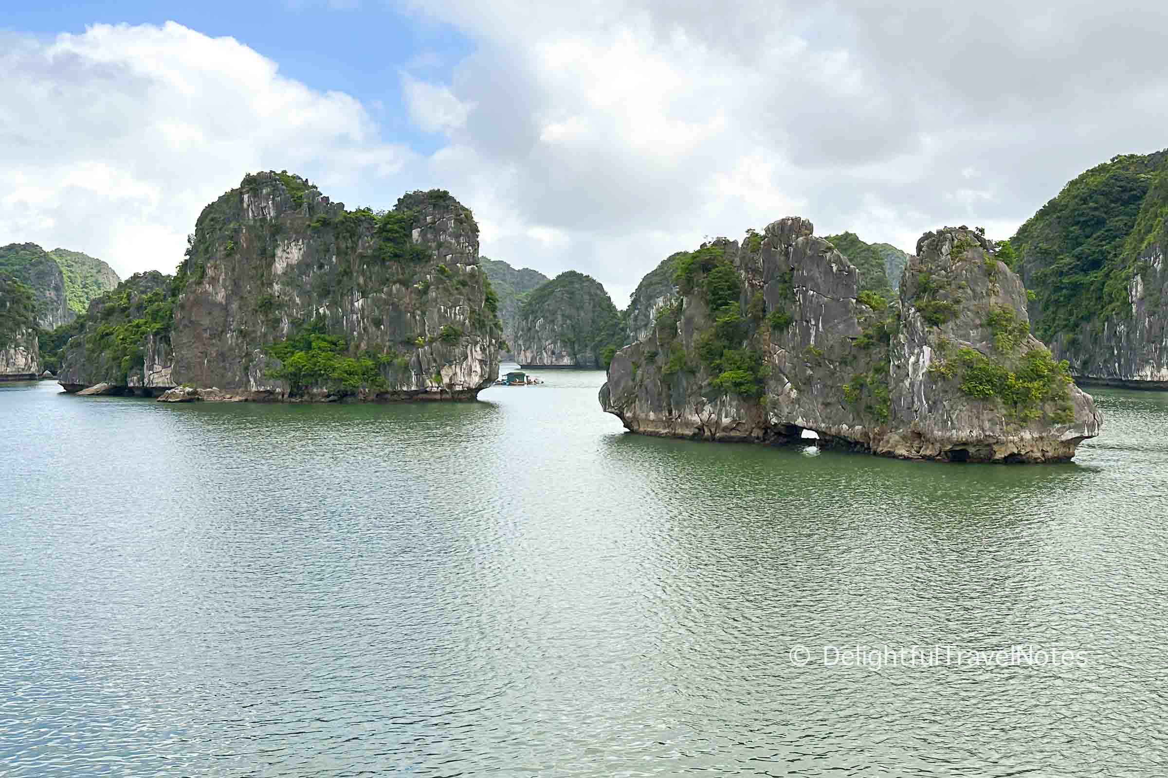 several limestone karst islands in Lan Ha Bay.