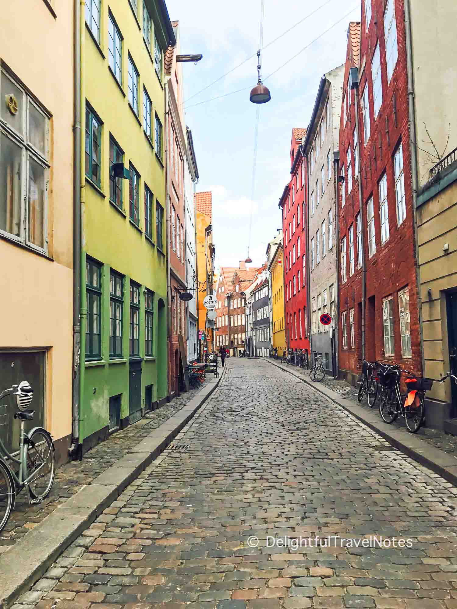 view of colorful houses on Magstraede, one of the oldest streets in Copenhagen - a must-see.