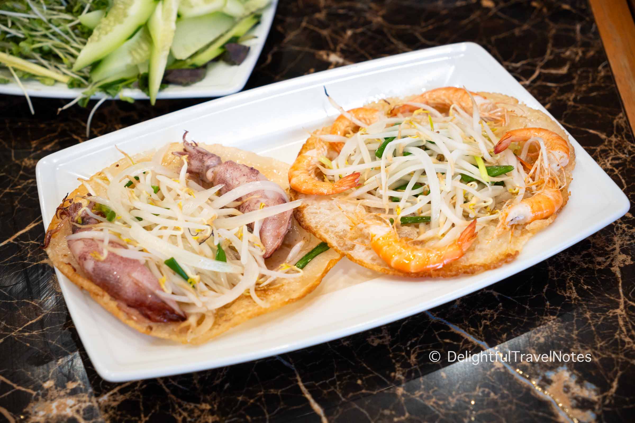 a plate of banh xeo Binh Dinh (sizzling crepes), a must-eat local specialty.