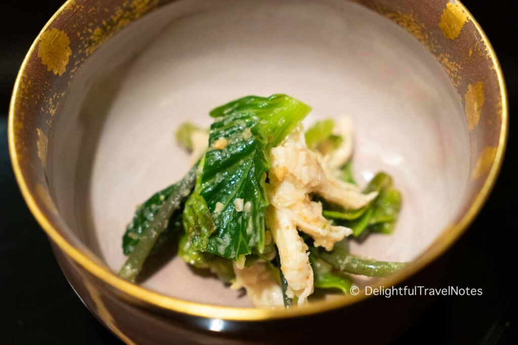 a bowl of green vegetable salad at Hassun restaurant in Kyoto.