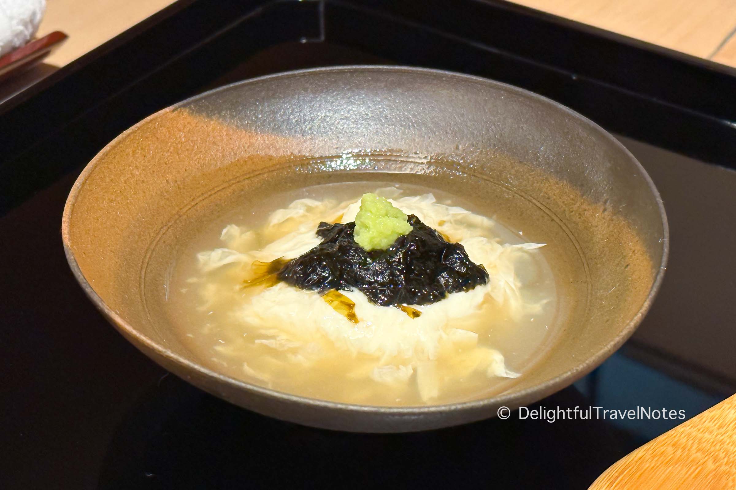 a bowl of yuba with seaweed served at Hassun restaurant in Kyoto.