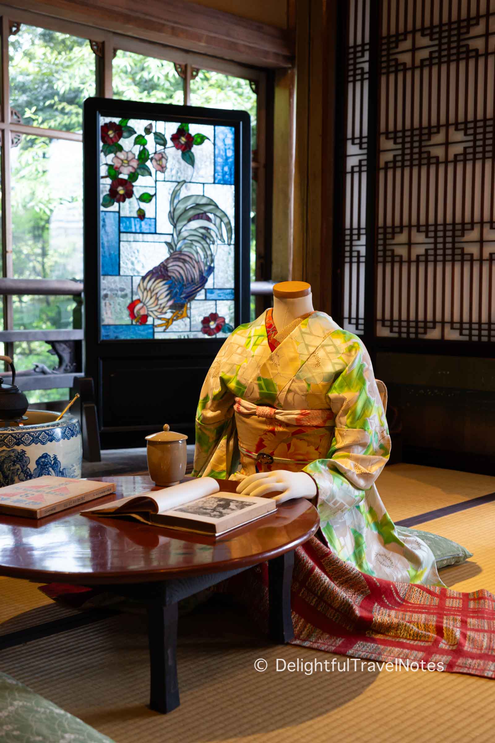 A figure in kimono at Hyakudan Kaidan exhibition.