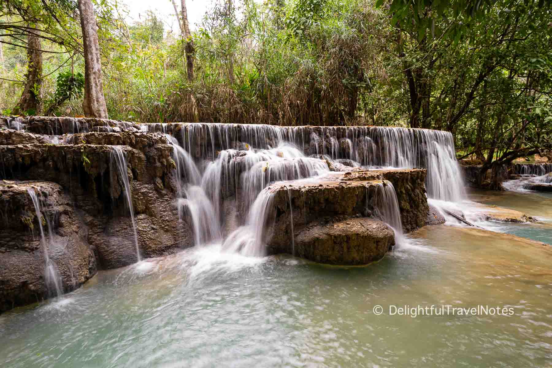 cascading water at Kuang Si waterfall in Luang Prabang, Laos.