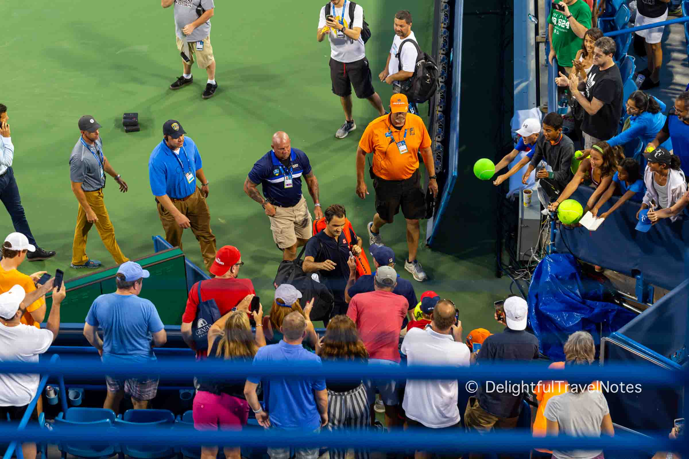 Federer signing for fans after his match in the Center Court at Western & Southern Open 2018.