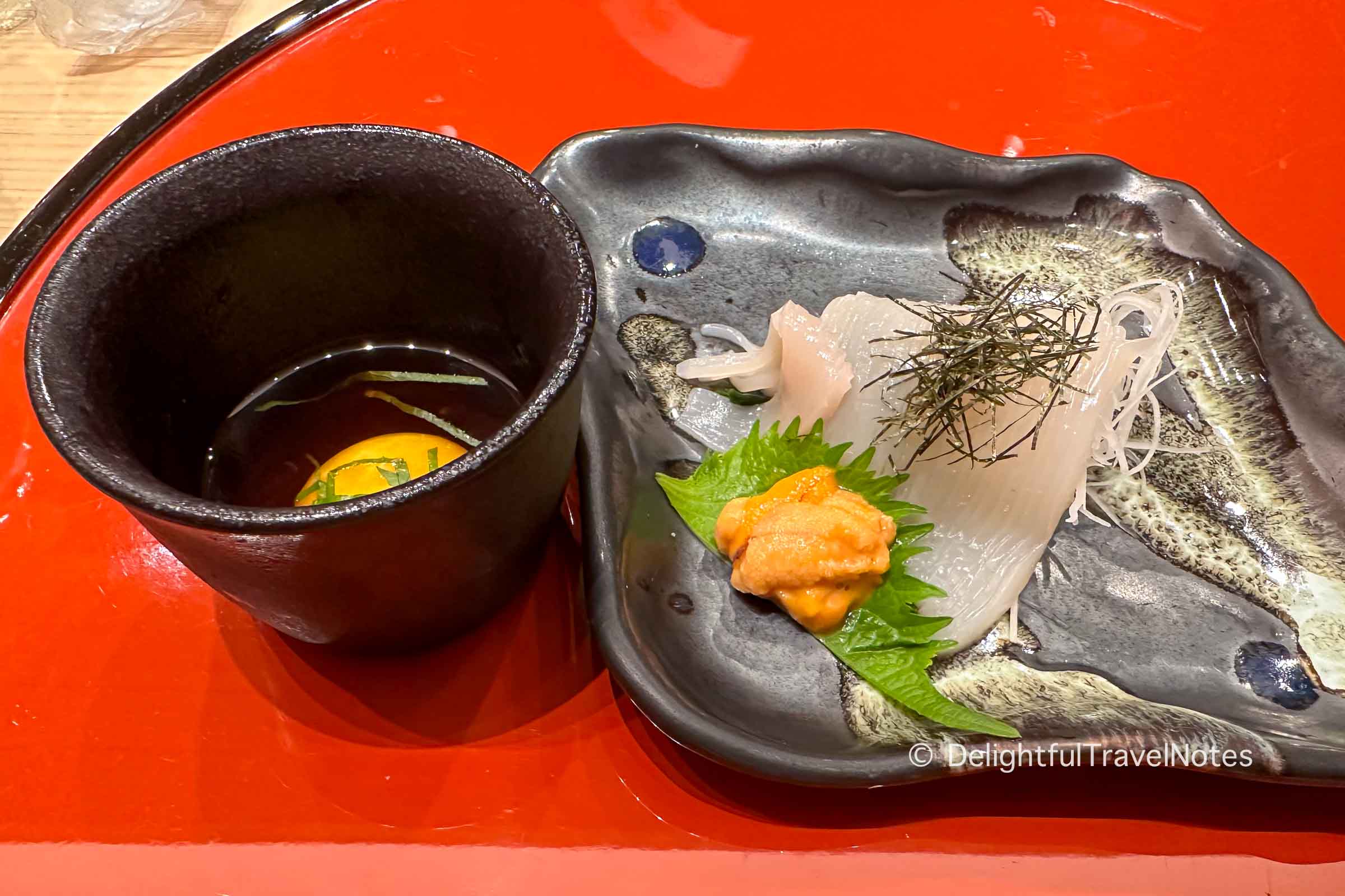 a plate of squid somen with uni sauce at Otaru Masazushi Ginza in Tokyo.