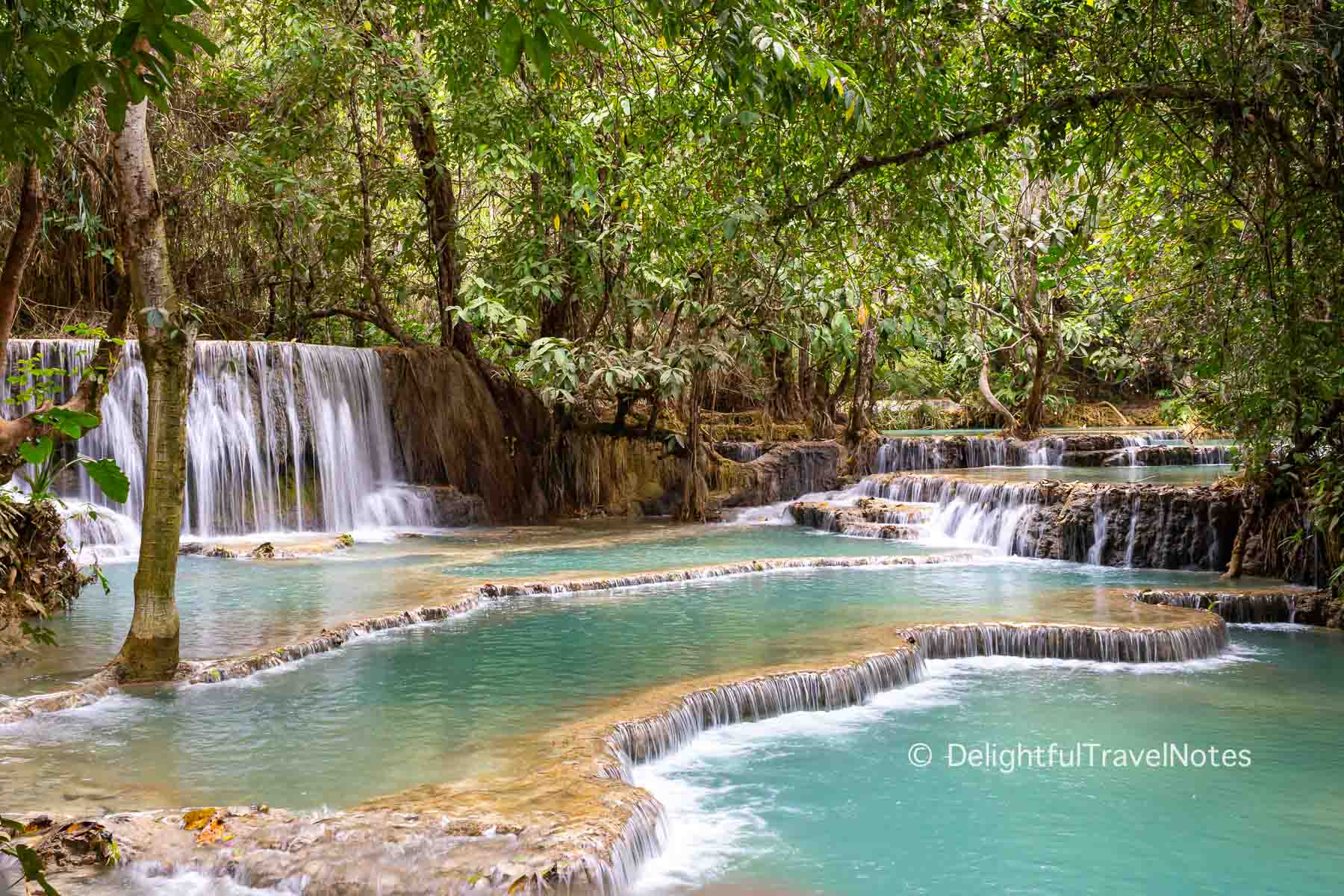 Multiple small pools of Kuang Si Falls in Luang Prabang Laos.