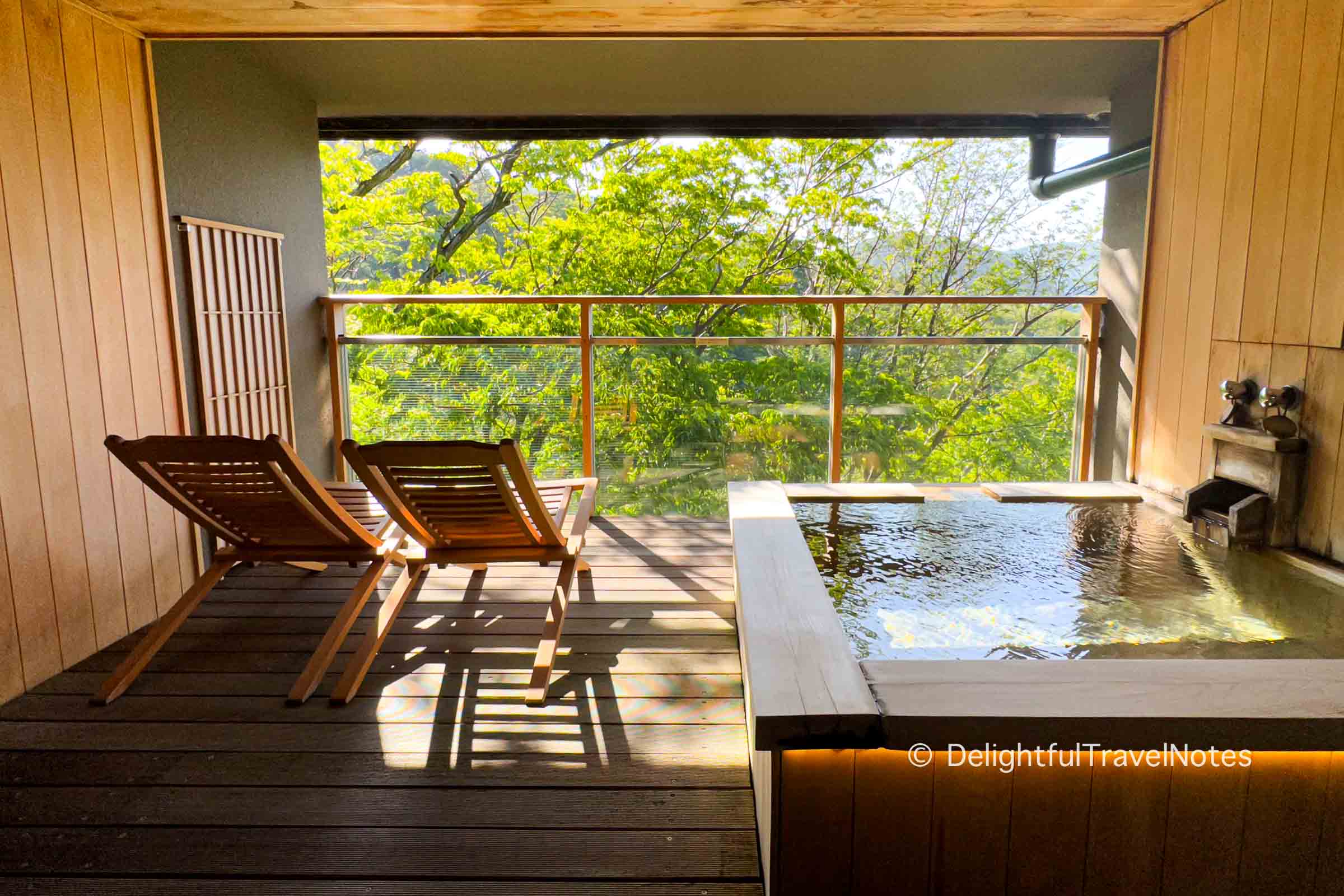 a balcony with private outdoor onsen at Madoka no Mori ryokan in Hakone, Japan.