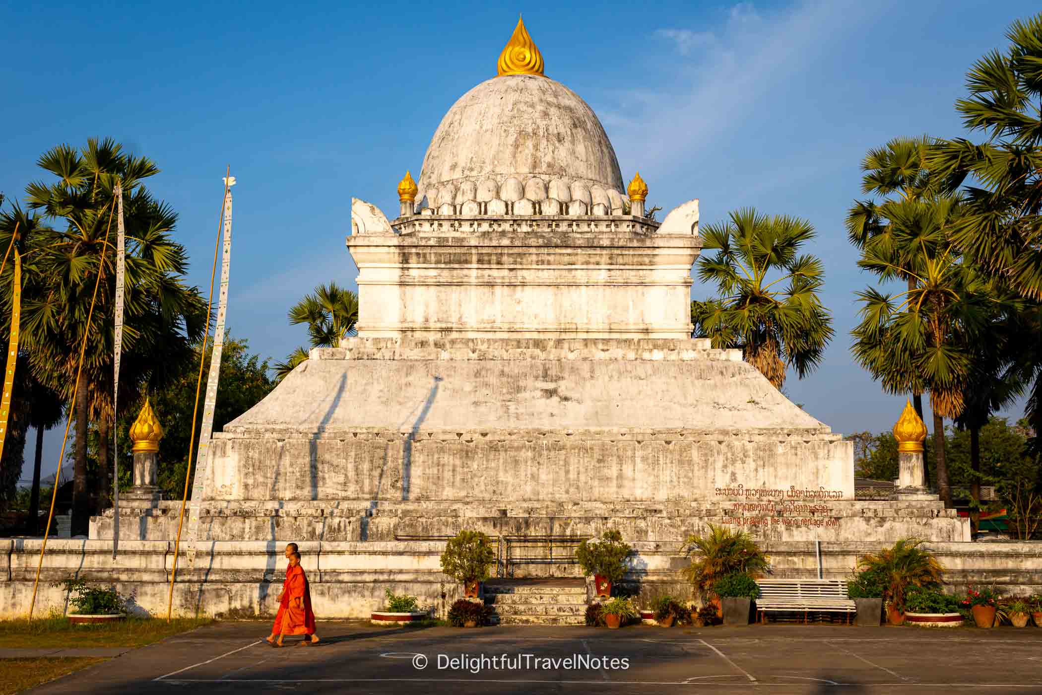 the stupa of Wat Wisunarat glowing at sunset in Luang Prabang.