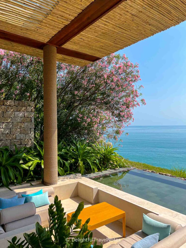 a lounging area with beach view in the lobby at Mia Resort Nha Trang, Vietnam.