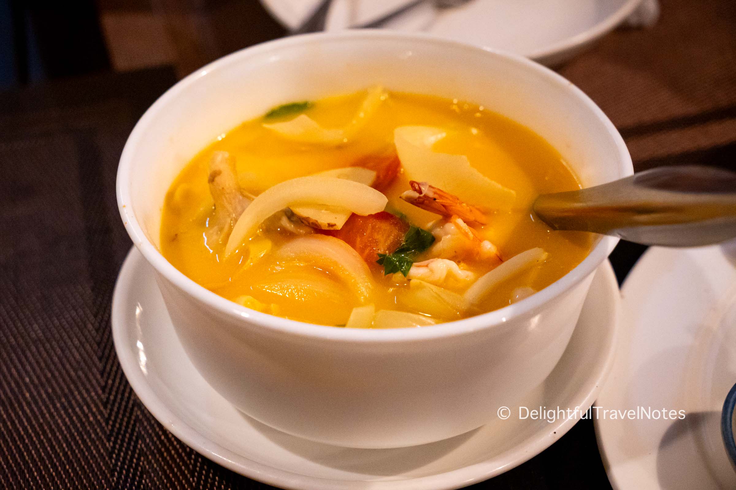 a bowl of tom yum soup at Bamboo Garden restaurant.