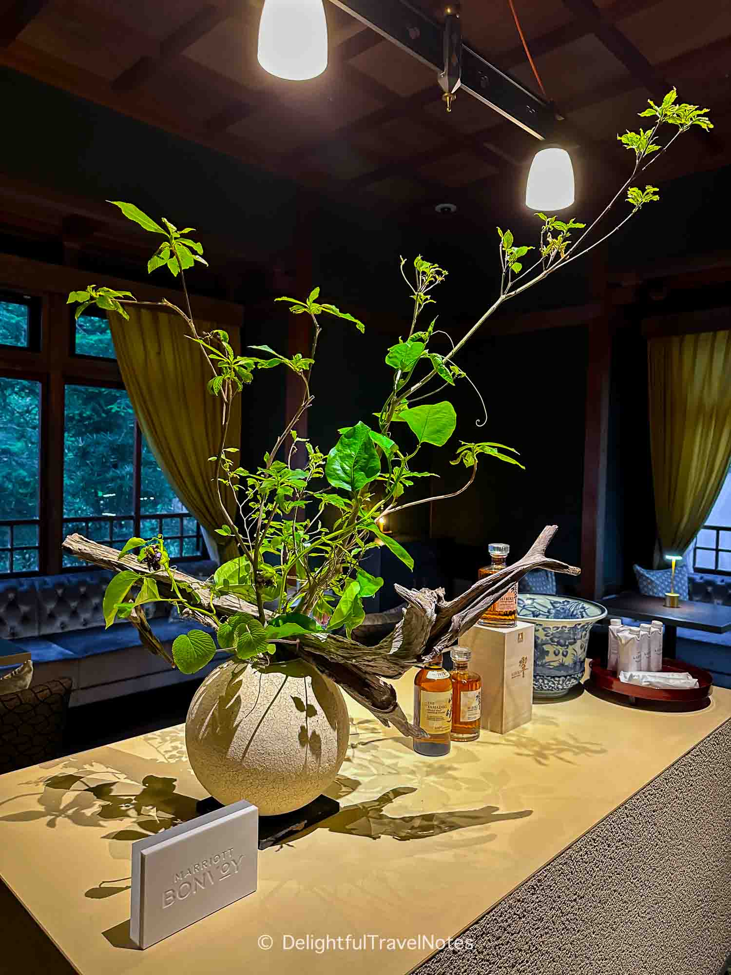 a flower vase displayed in the hotel guest lounge.