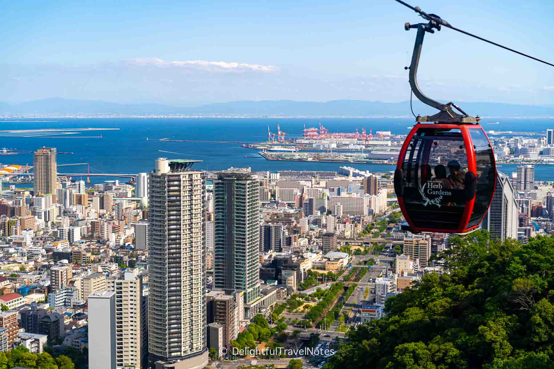 view of Kobe city, the port and a cable car from Nunobiki Ropeway.