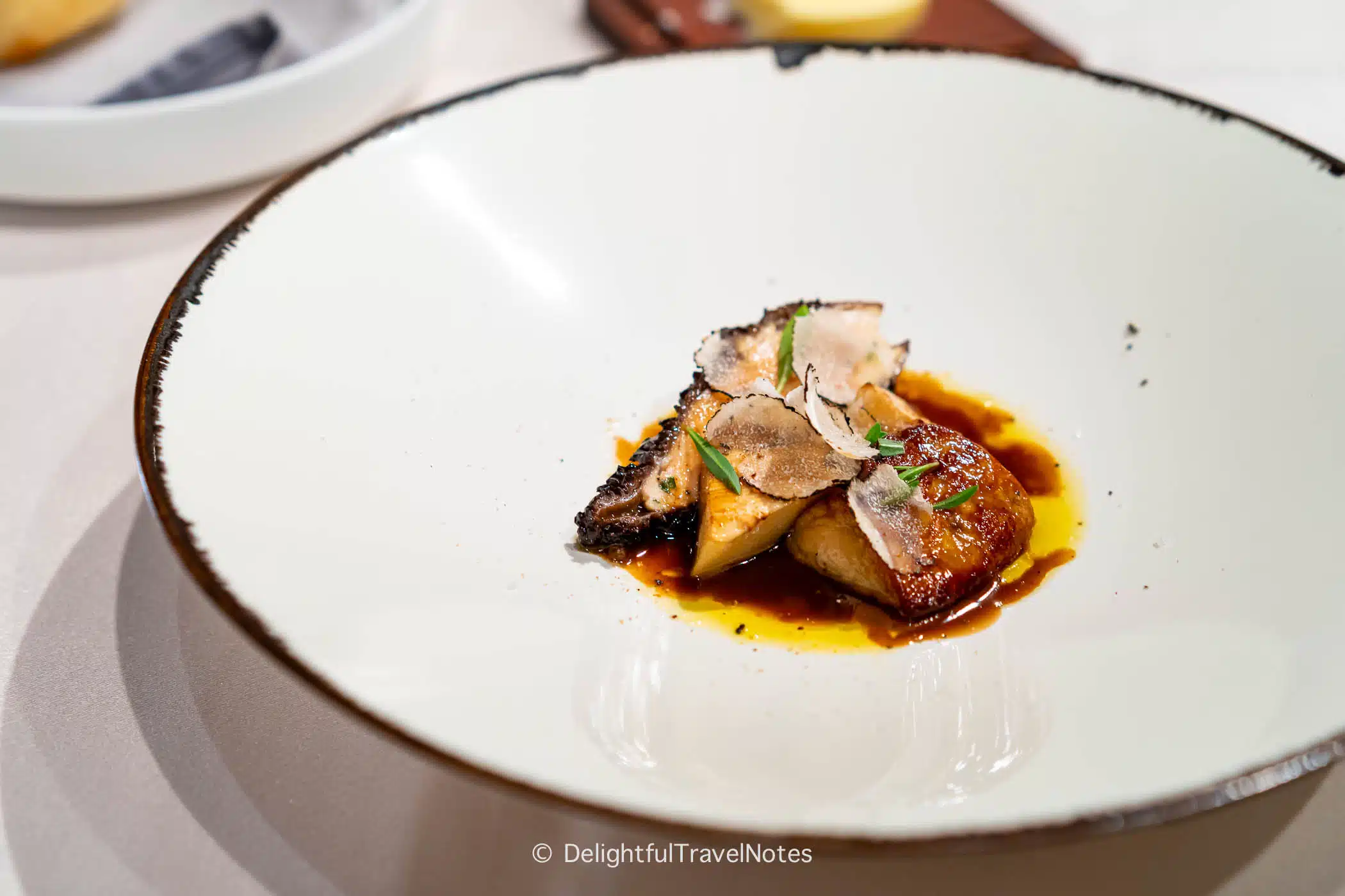 a plate of foie gras and stuffed morel with wine sauce served at La Terrasse French restaurant in Nara.