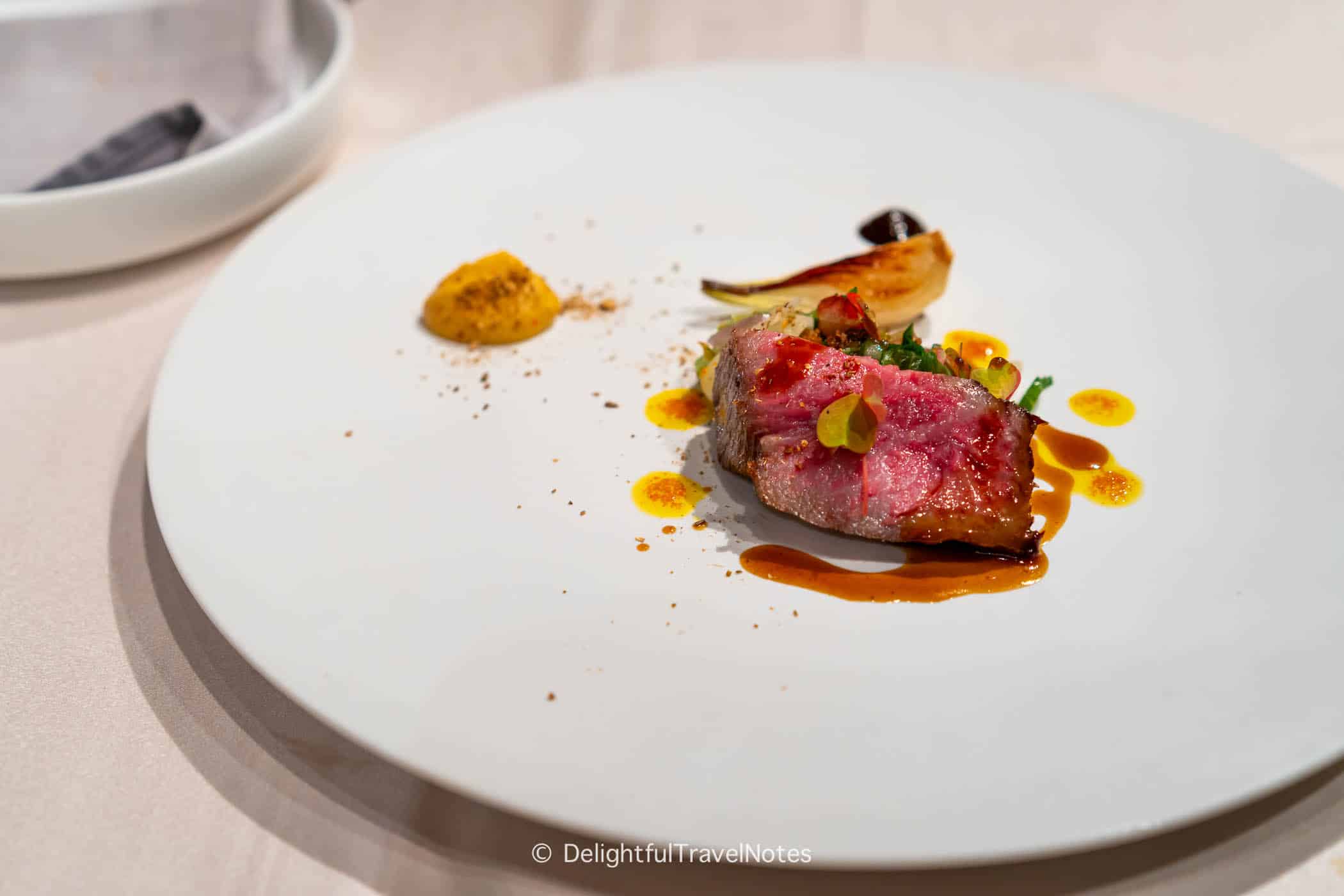 a plate of Kuroge wagyu beef course.