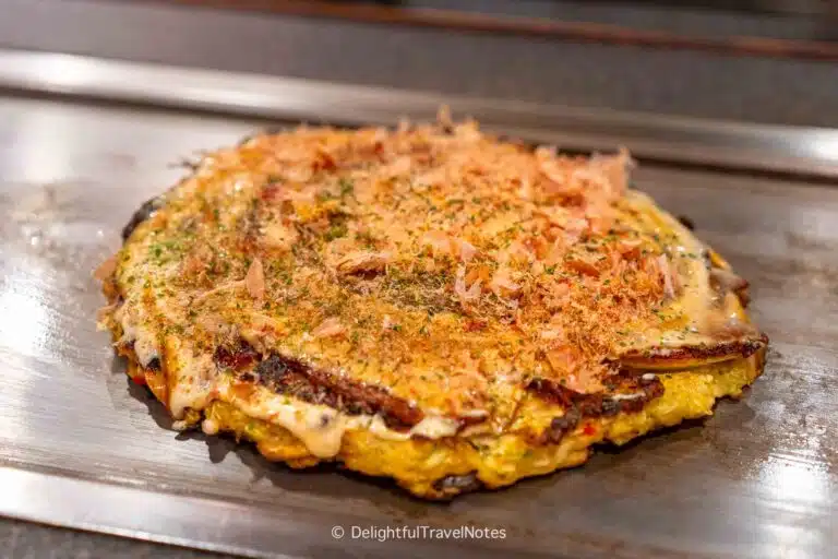 an okonomiyaki on the teppan at Hirokazuya Higashidori in Osaka.