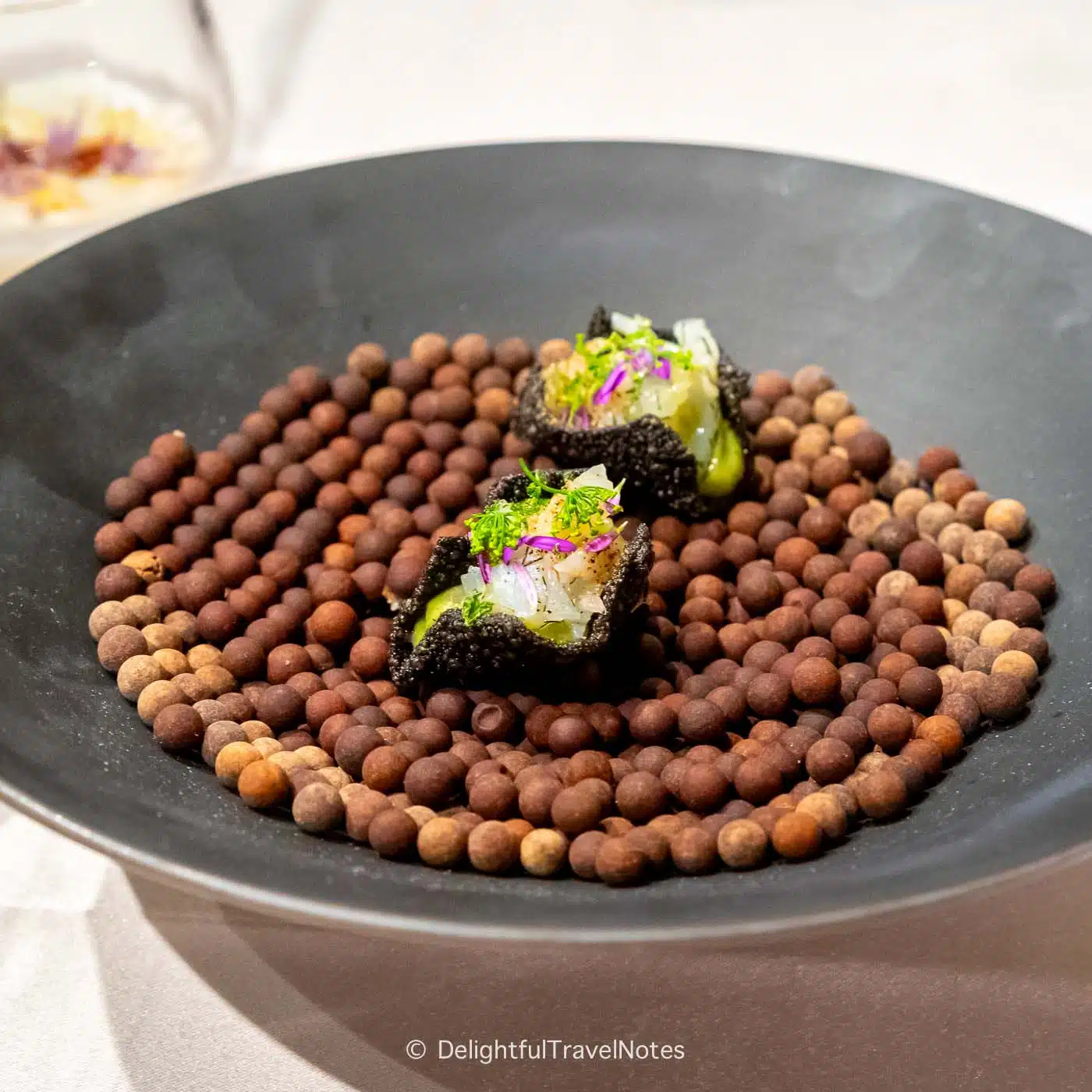 squid bites on squid ink crackers