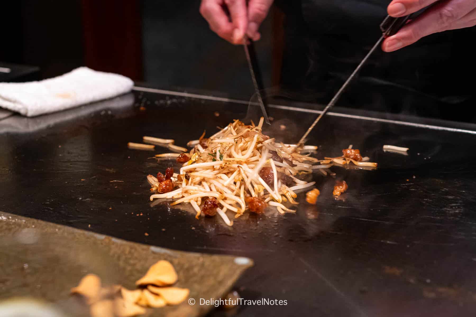 Chef stir-frying the fried rice on the teppan at Kobe Beef Steak Ishida.