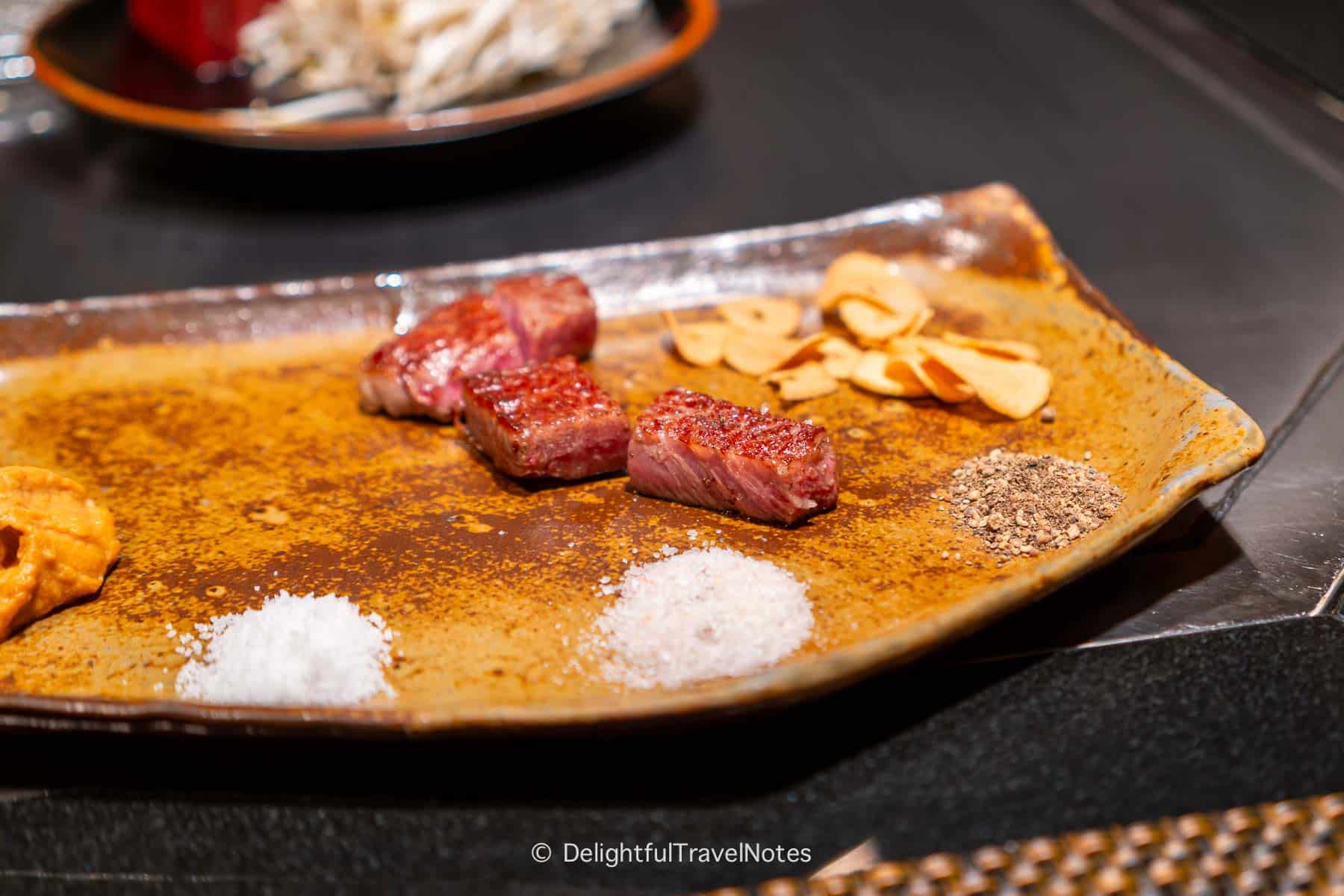 Grilled and sliced Kobe beef served on the plate.