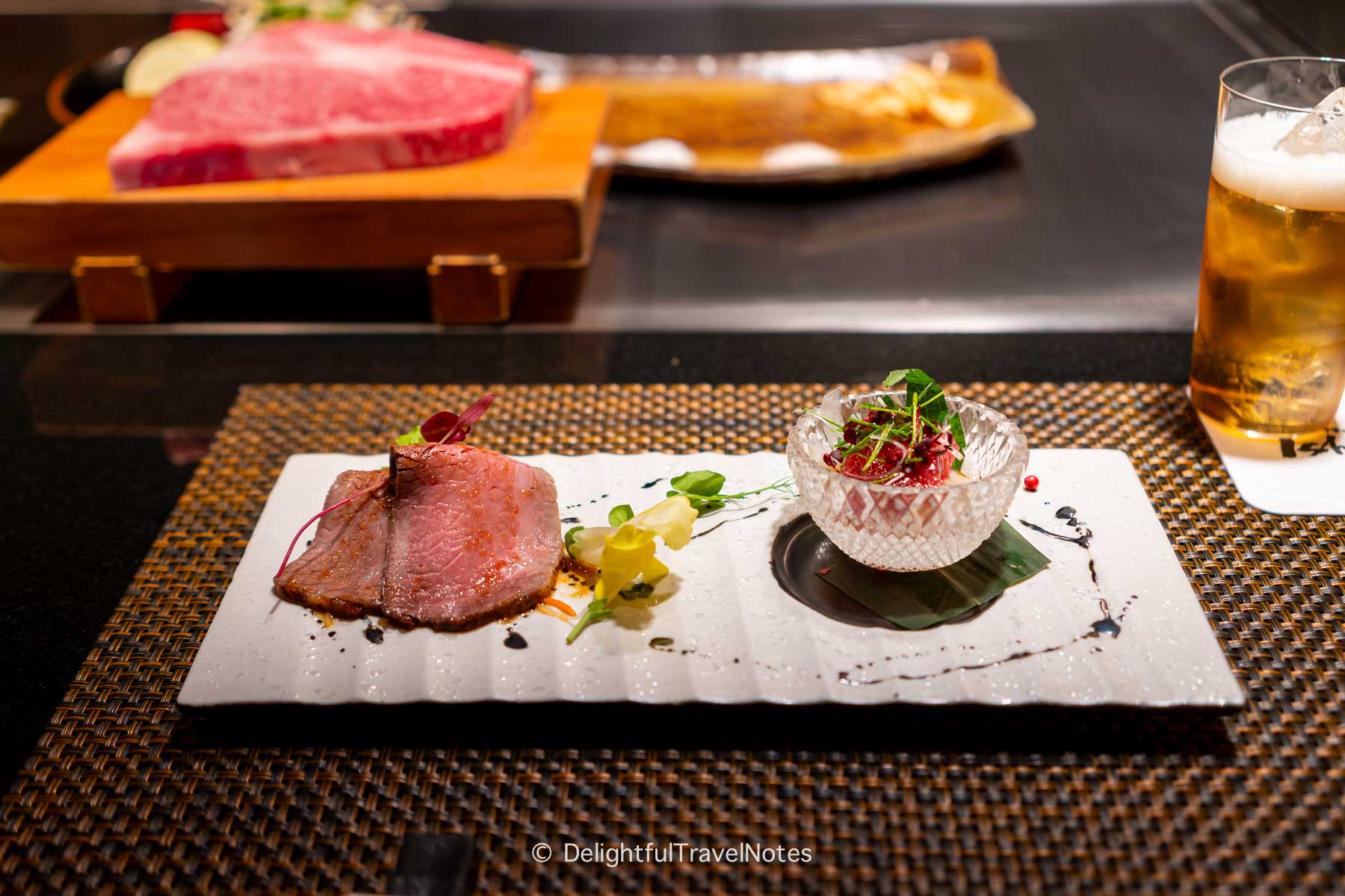 a plate of roast beef and tuna appetizer.