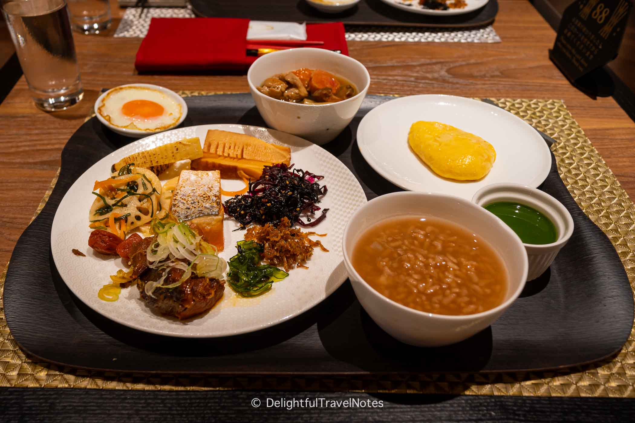 a breakfast tray with Kaga boucha porridge and side dish at The Sanraku Hotel Kanazawa.