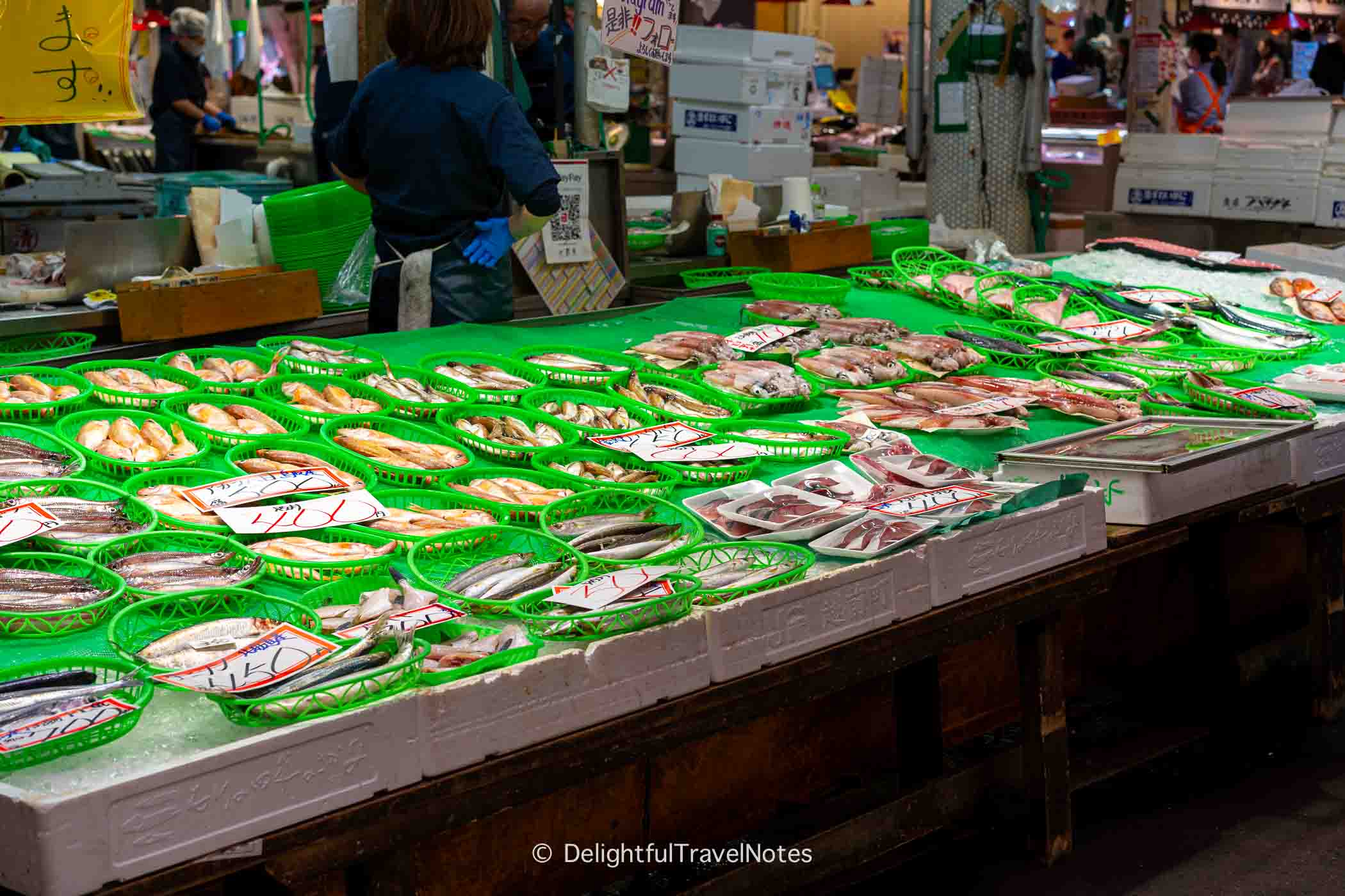 Fresh seafood displayed at Omicho Market in Kanazawa.