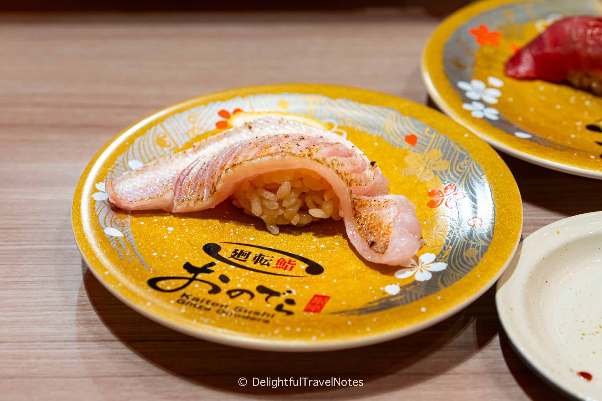 a plate of nodoguro nigiri at Kaiten Sushi Ginza Onodera in Osaka.