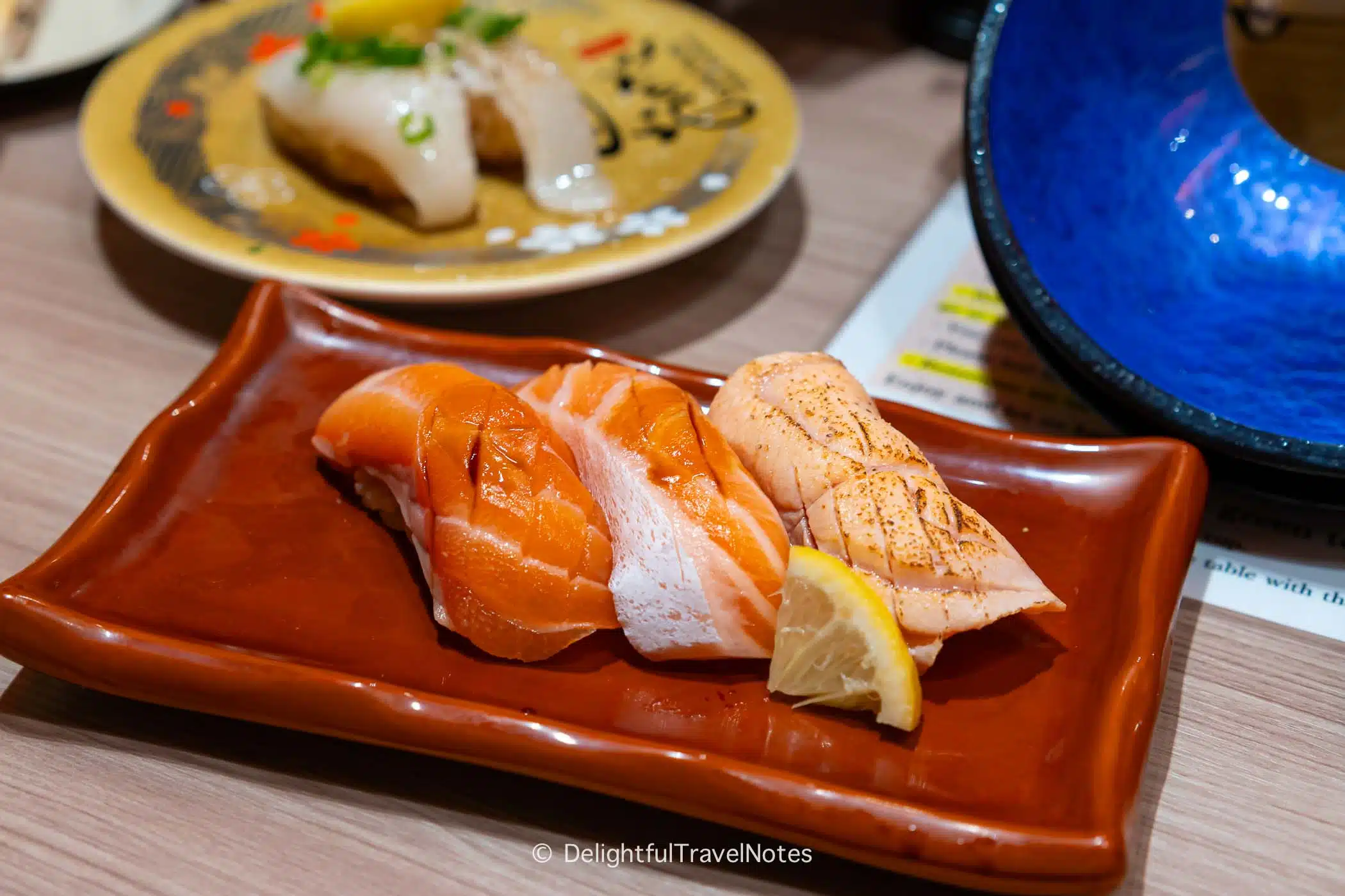 Salmon nigiri platter at Kaiten Sushi Ginza Onodera in Osaka.