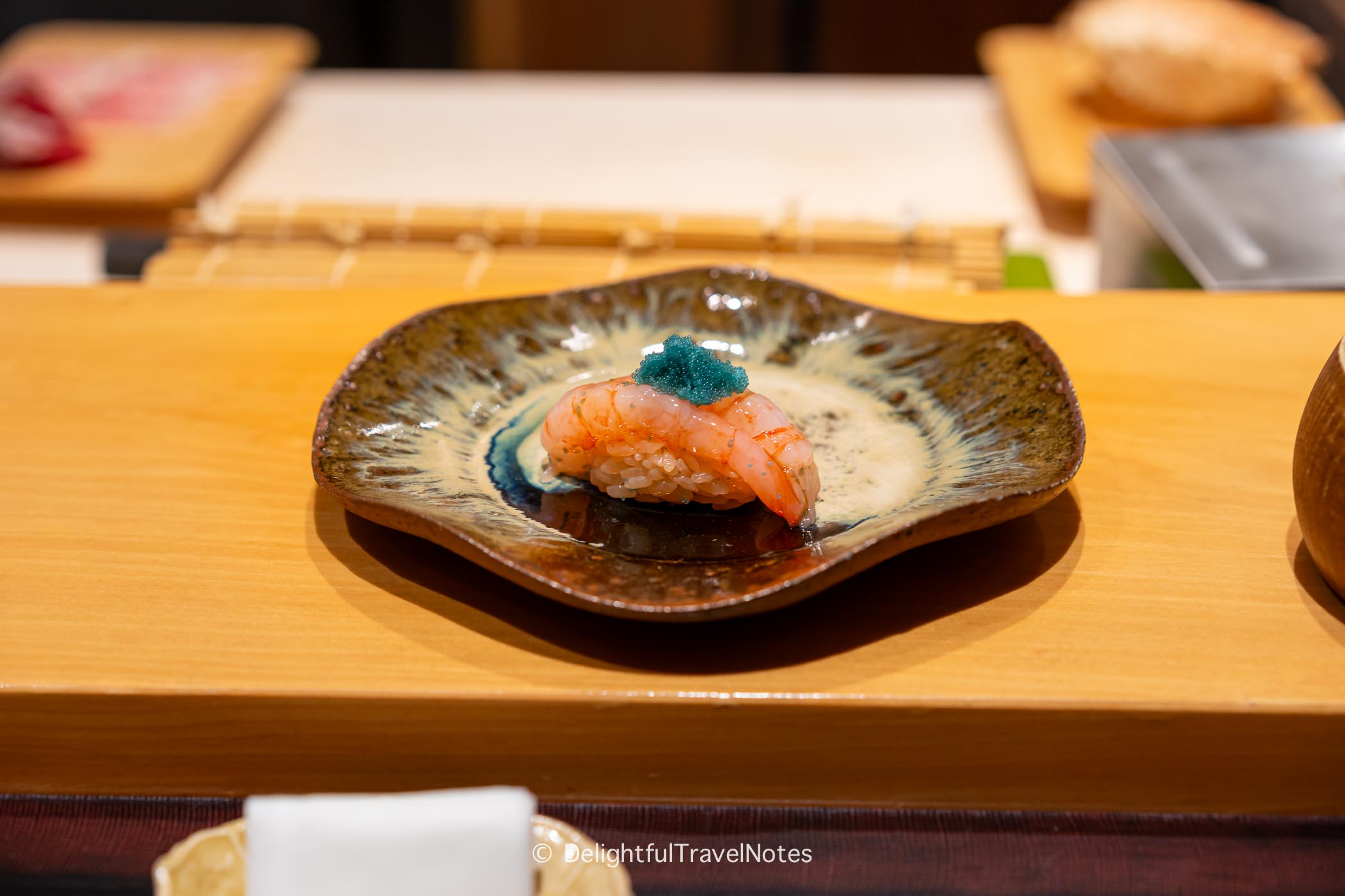 Sweet shrimp nigiri on a plate at Sushi Issei omakase in Kanazawa.