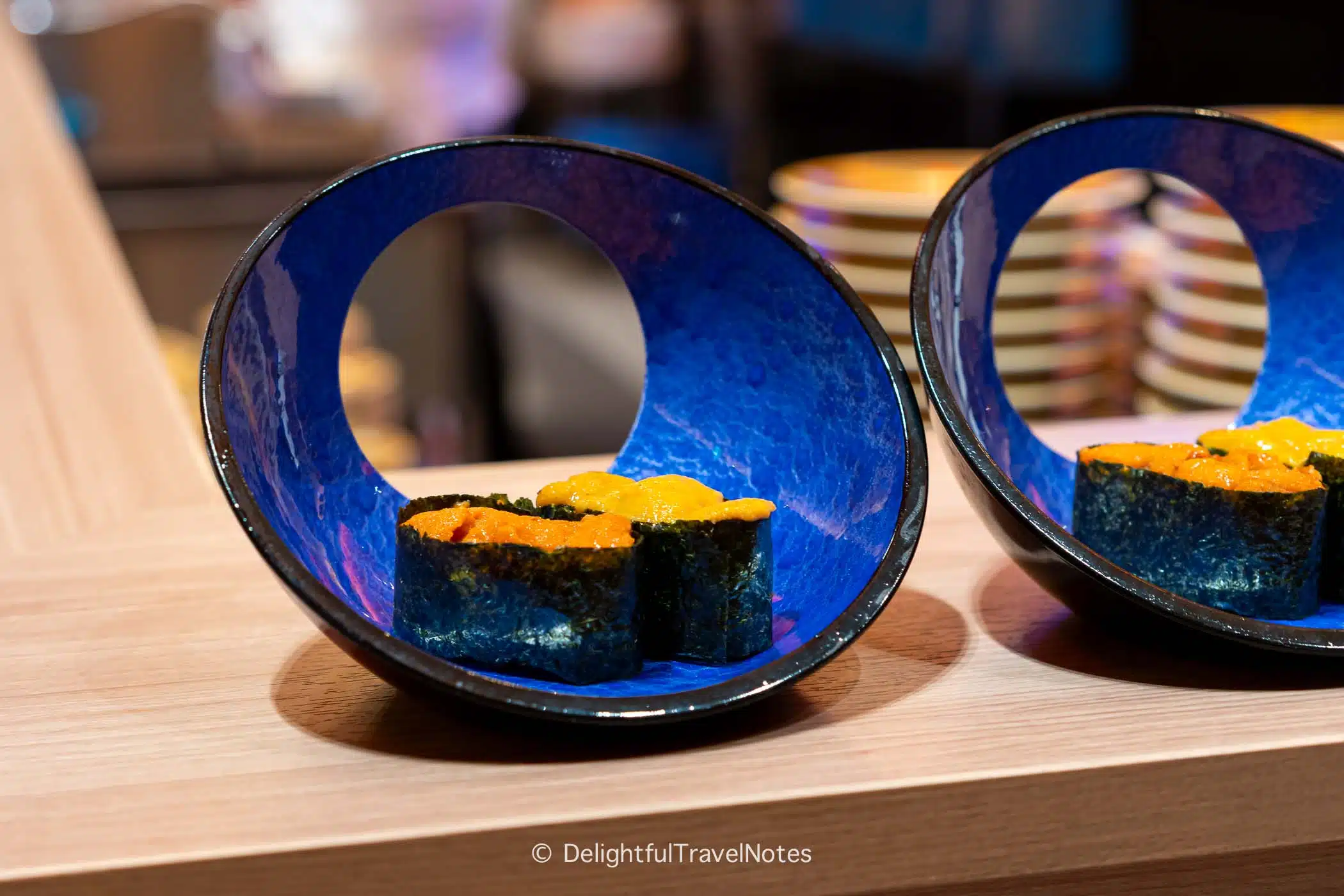 a plate of uni sushi at Kaiten Sushi Ginza Onodera, high-end and better quality conveyor belt sushi.