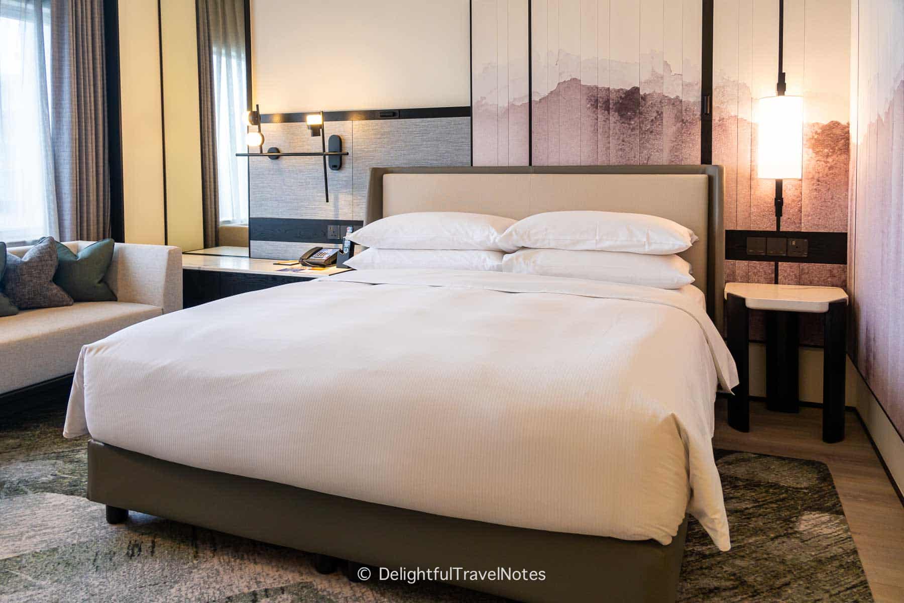 King bed in the bedroom at Hilton Singapore Orchard.