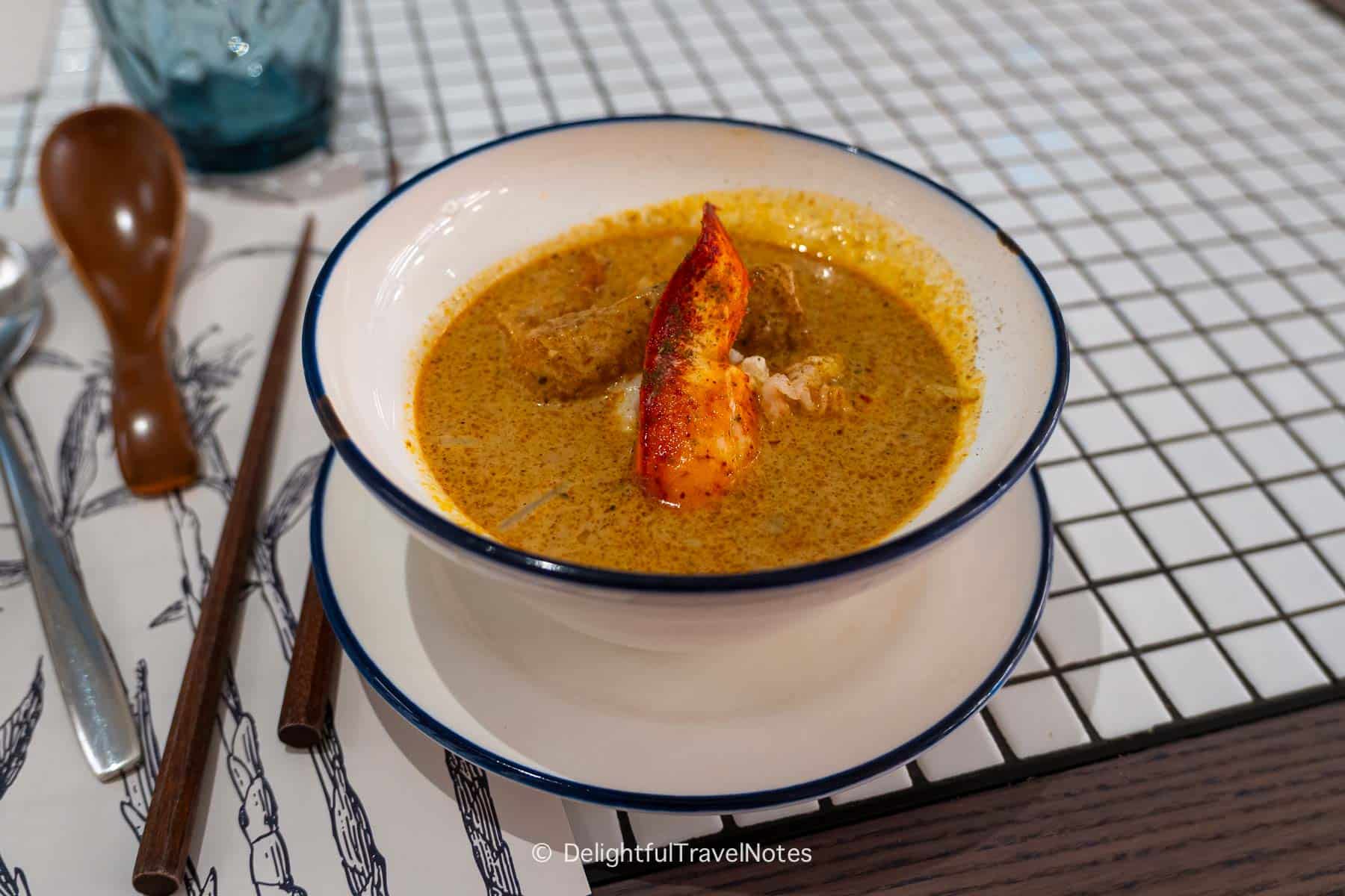 a bowl of Lobster laksa at Chatterbox restaurant in Singapore.