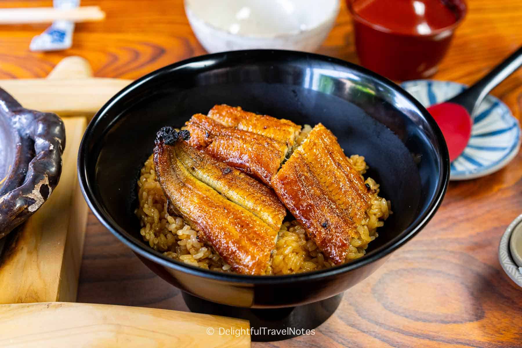 a bowl of unadon, grilled eel rice bowl at Warajiya restaurant in Kyoto.