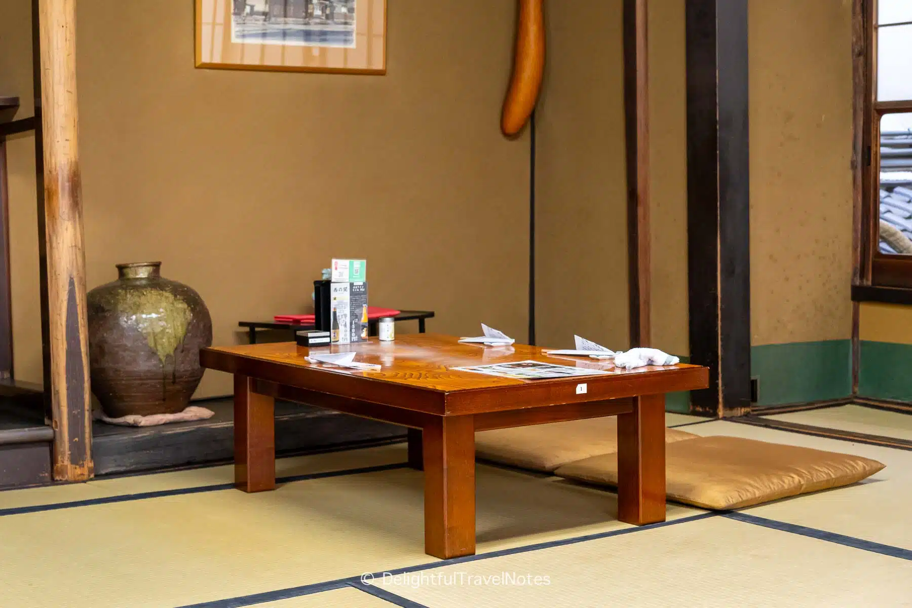 a low table with two cushions for seating in the tatami room at Warajiya eel restaurant in Kyoto.