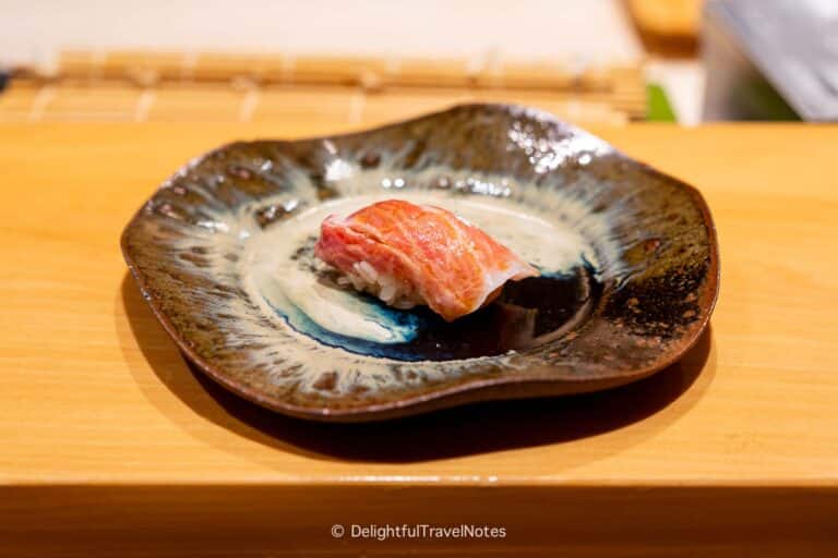 a piece of tuna toro nigiri served on a plate at Sushi Issei in Kanazawa.