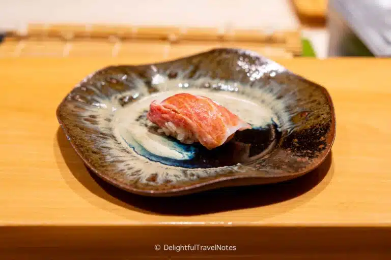 a piece of tuna toro nigiri served on a plate at Sushi Issei in Kanazawa.