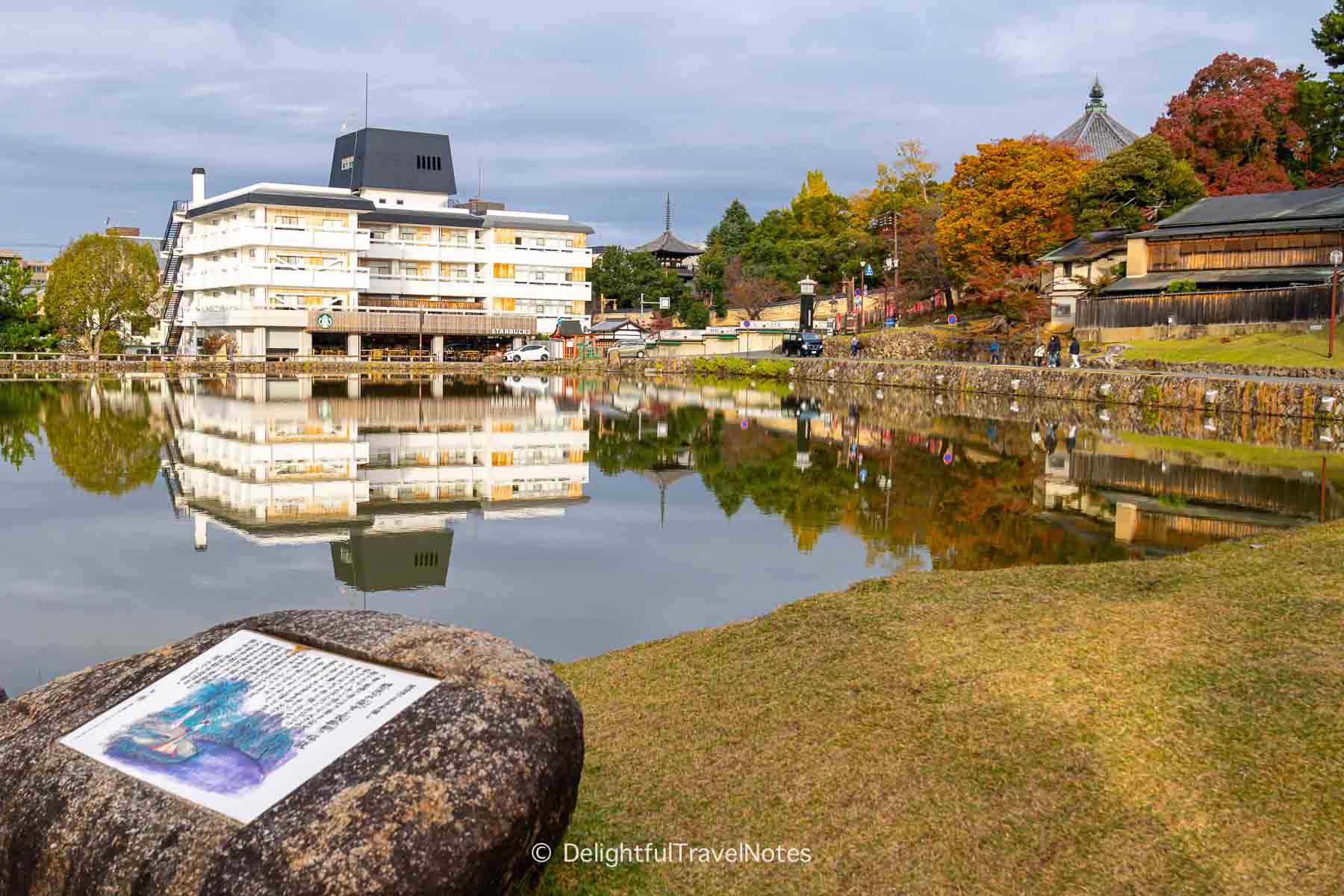 Starbucks building and its reflection in Sarusawa Pond in Nara, Japan.