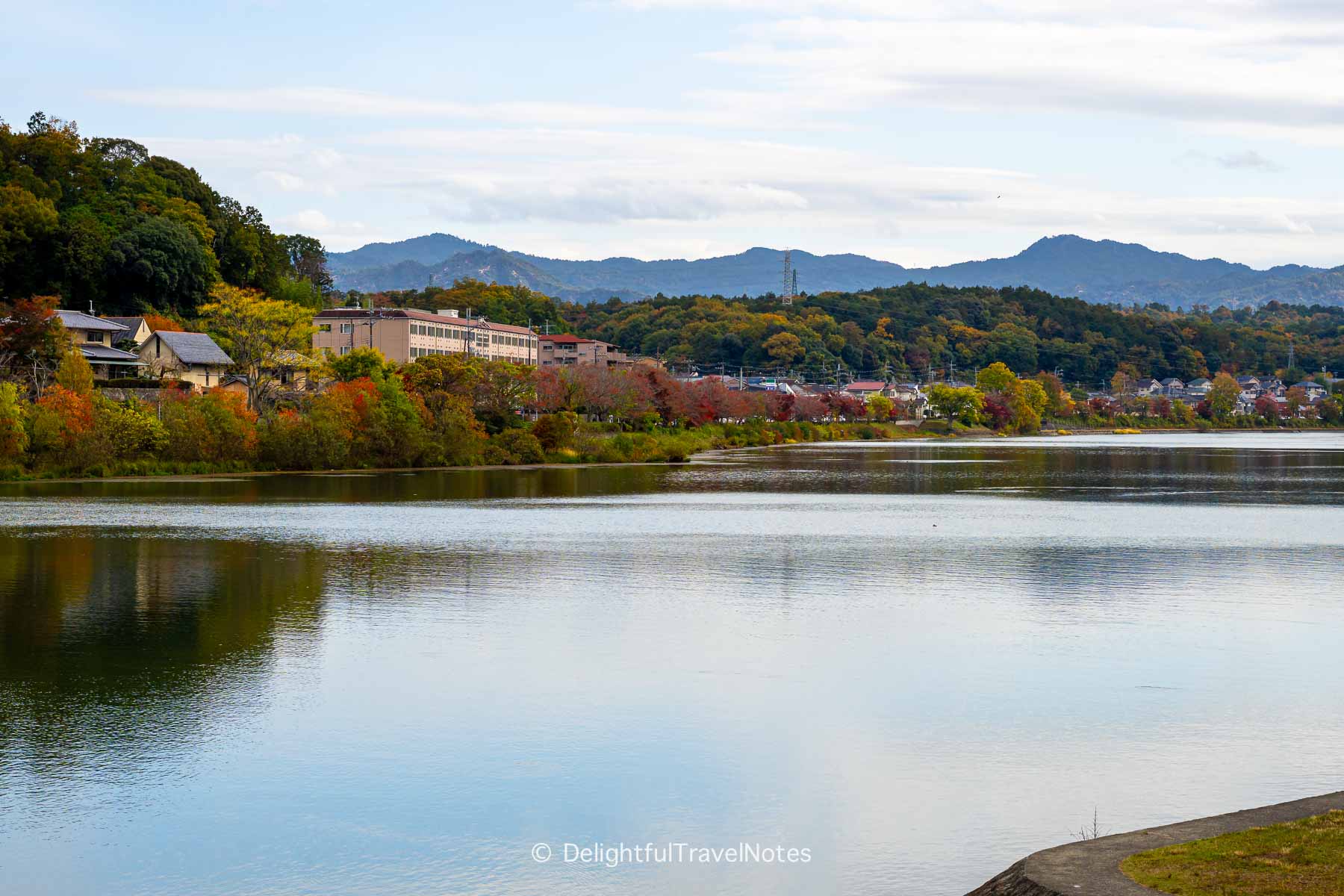 Scenic fall foliage view of Seta River outside Ishiyamadera Station.