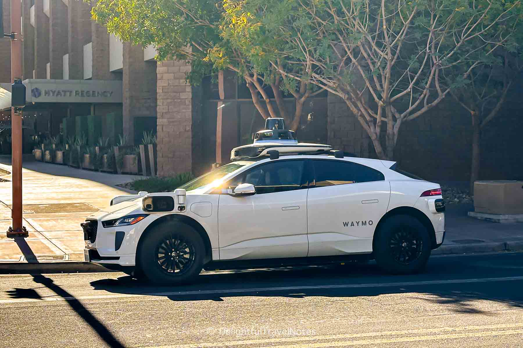 Waymo self-driving taxi parked on Phoenix (Arizona) street.