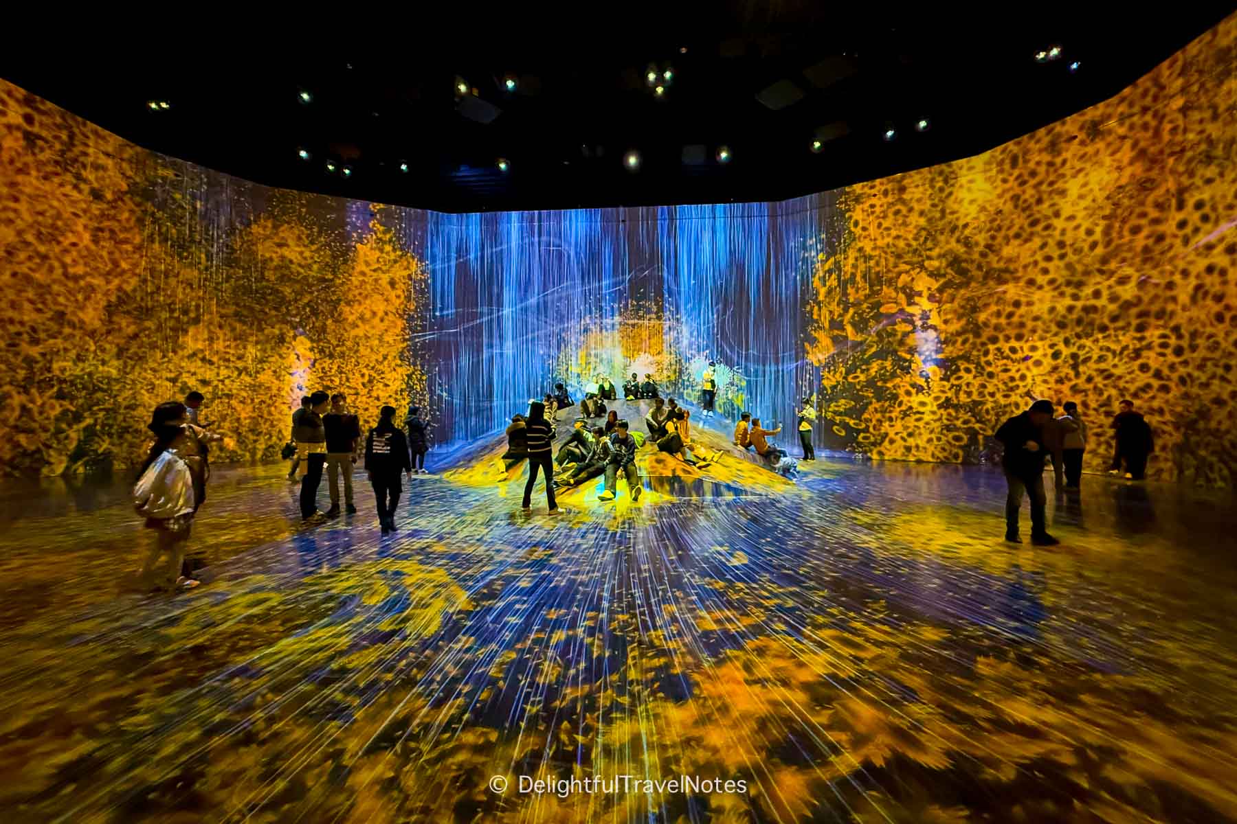 Oasis room with cascading waterfall at TeamLab Borderless in Tokyo.