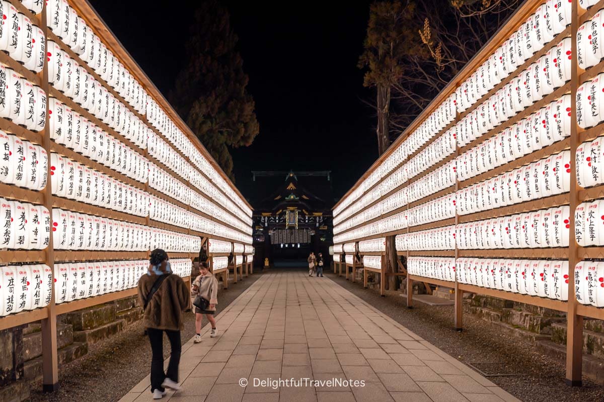Lit up lanterns at night Kitano Tenmangu Shrine Kyoto.