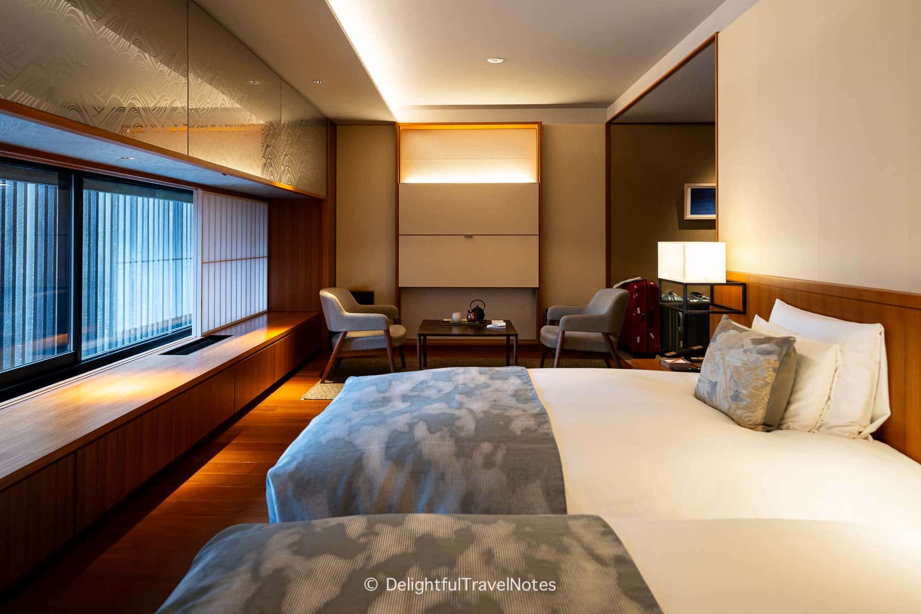 Table and chairs in deluxe room.