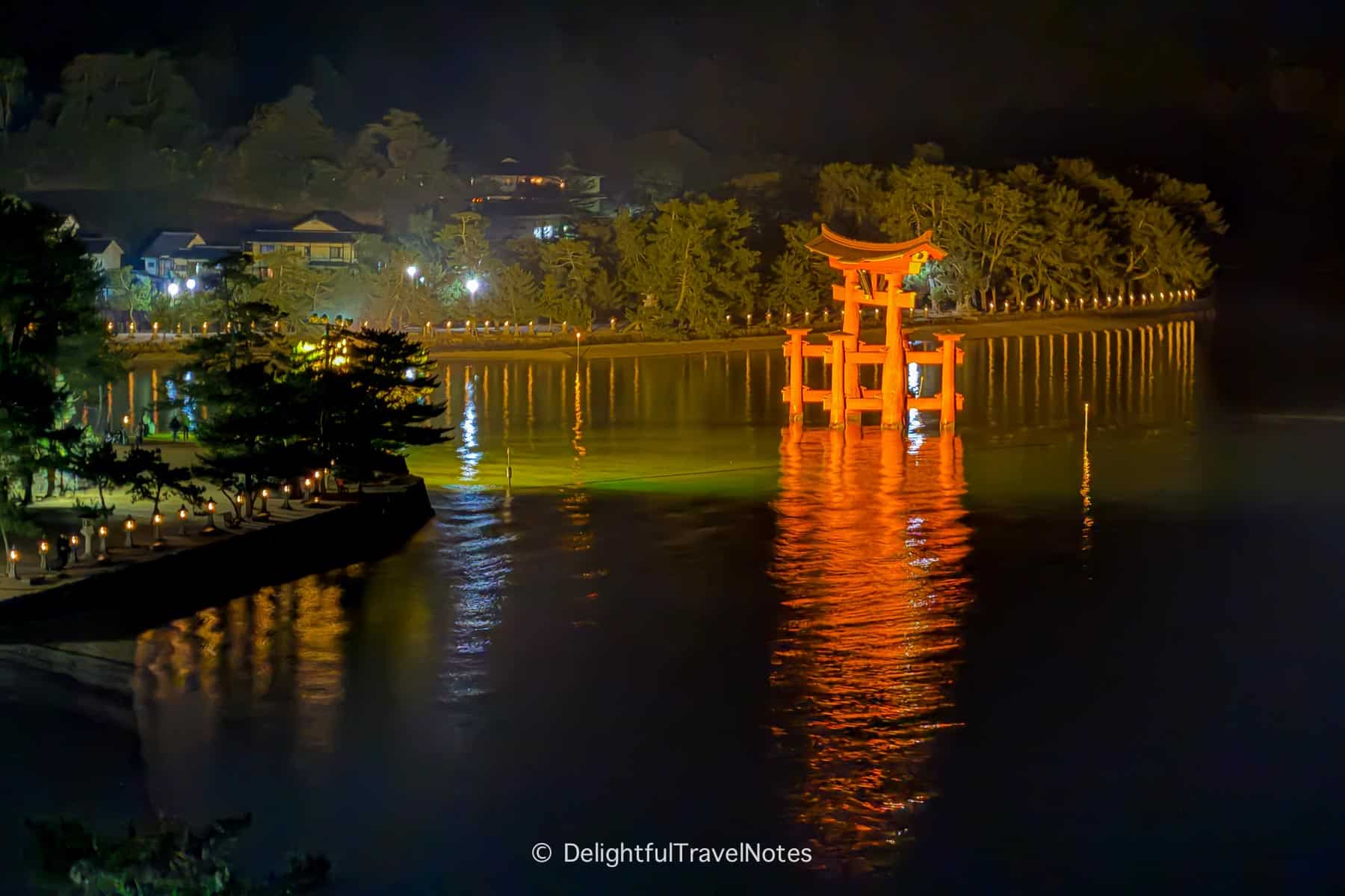 View of the floating torii at night from Kinsuikan Miyajima rooftop.